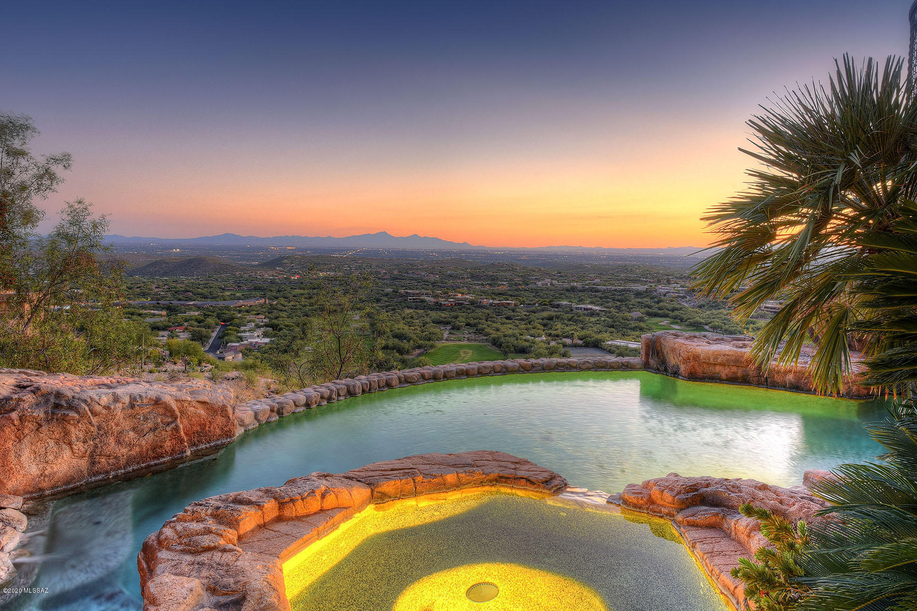 Exquisite Desert Inspired Design. Sophisticated 11539 sq ft 7 bedrm/8 bath estate. Nestled in the mountain enjoy one of the best lots in Ventana Canyon overlooking the city of Tucson on 2.3 acres. Commercial build w/highest quality materials, coffered 24' ceilings, custom 10' knotty alder doors & natural materials throughout. Well designed floor plan ideal for families, visitors, multi-gen living or corporate events w/adult living area on one floor, mother-in-law suite & 2nd guest quarters. Grand living room welcomes you w/ incredible panoramic floor to ceiling glass windows showcasing all of Tucson. Home completely updated w/open chef kitchen, luxurious baths & storage. Huge owners suite w/his & her baths, walk-in closet & personal gym. Outdoor oasis w/resort-style pool/spa. See More tab. New top of the line Fischer & Paykel ovens & 5 burner gas range. Enjoy modern conveniences of Sub-Zero fridge, freezer & refrigerated drawers, warming drawer, prep sink + 2 dishwashers. Incredible attention to detail with tons of storage, cozy breakfast nook, office space, laundry unit & delightful mud room. Sound dampening panels in Entertainment Area includes screening room, billiards room, custom historic wood bar with stained glass, wine cellar, sub zero fridge & 2 freezer drawers. You will also find patio with lush greenery, outdoor fireplace, built-in BBQ & views of the Tucson Foothills Catalina Mountains. The Owners Retreat creates a luxurious atmosphere w/ panoramic views, private patio & large personal gym. Spa like master bath boasts dual vanities, custom jetted tub, oversized walk-in shower, his & hers water closets. Massive custom closet with built-ins & safe room.

Executive office area also resides on the main level with stunning knotty alder built-ins , specially made granite & rock U-shape desk. The second office on the main floor would be an ideal setting for "home schooling" with 6 workstations & Top of the Line High-speed internet. The multi-level south patio is a true outdoor oasis which is ideal for indoor outdoor living w/ built-in BBQ, large covered patio & bar + 1/2 bath. Enjoy the endless views in your resort style pebble tech pool, separate spa & multiple water features. Speakers & ready to install misting system creating an unforgettable resort like experience for your family & guests. Custom wood elevator takes you to the lower level which is great for kids or extended family & includes 4 private bedrooms, 2 den spaces, 2 updated bathrooms, flex room & laundry room. Mother-in-law suite has separate entrance both to exterior and main house with bedroom, family room, breakfast bar, kitchenette & full bath. Every inch of the home is well thought out. 6 car garage + golf cart garage includes heated & cooled workshop + an additional 17 parking spaces.

A 24 Hour attended Guard Gate provides security for your family and estate. https://www.ventanacanyonclub.com This home has been engineered with low maintenance in mind, masonry construction, steel roof and natural stone. Great circulation space can easily handle many people 50-100+ for large family gatherings or corporate events. Value of the land and lot preparations easily over $1M itself. The smart design has the entire adult living area on a single floor. Resort style front and back yard designed by award winning John Stropko/New Desert Gallery. A solid feel and a peaceful natural ambiance await your further exploration.
Everything has been done & done right!!