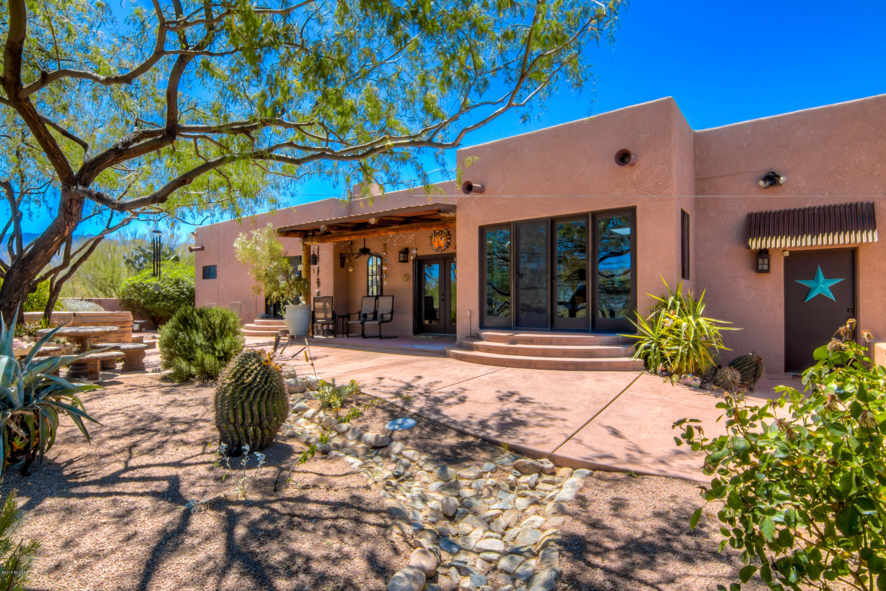 Dreaming of Privacy, Quiet, Views and meticulously cared for property, look no further. This private gated property is meticulous from the gate to back and the home is exceptional in every way. Fully remodeled by an expert, every detail has been attended to. Each bedroom has privacy and views, The library is ready for your books to arrive. Custom Maple shelving with views overlooking the fountain and a remarkable courtyard. New baths, kitchen, flooring, ac, all exceptionally done.  The Sellers believe the home to be 2485 sq. ft.