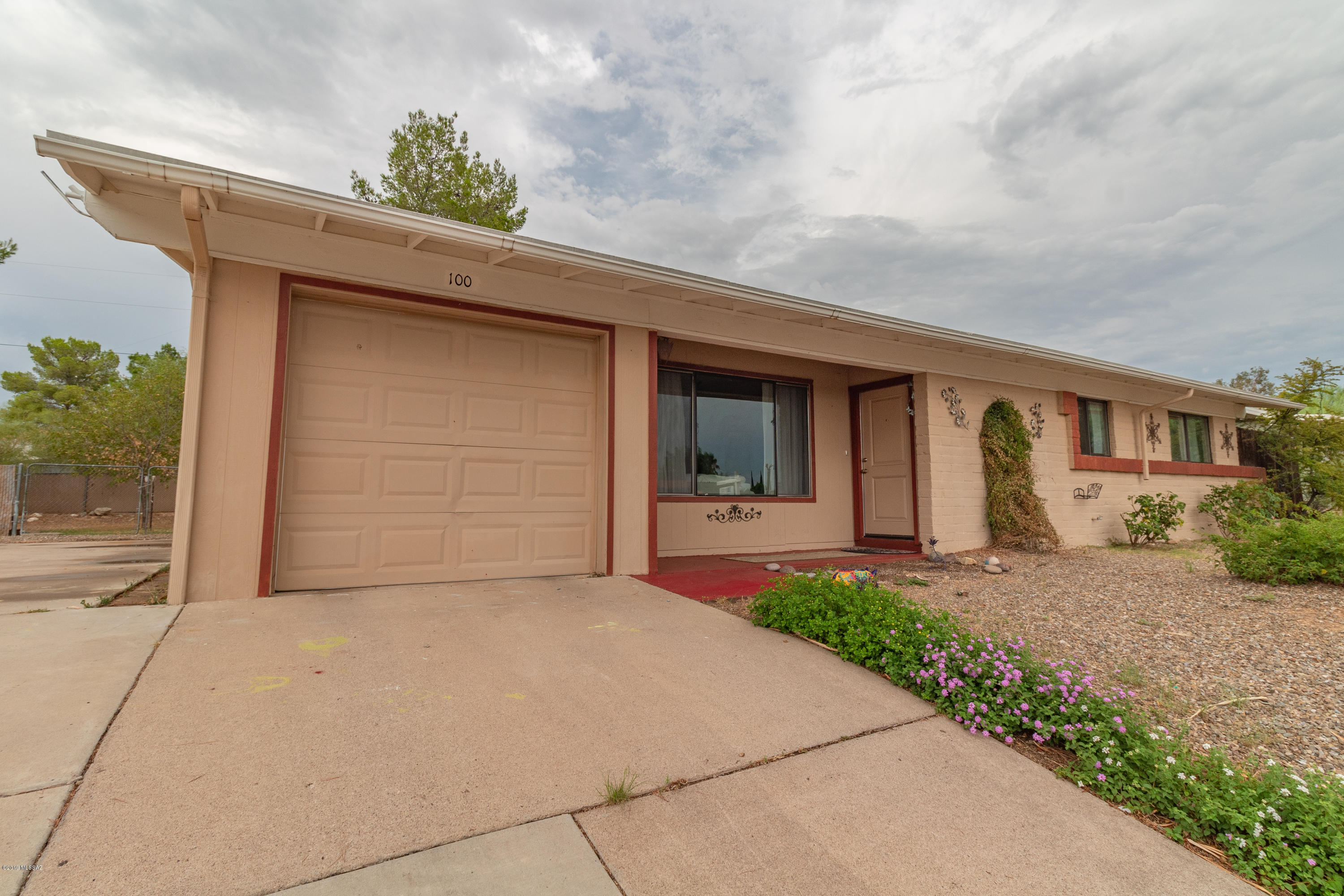 Gorgeous home located in Southeast Tucson on a massive lot! Upon entry you are welcomed with wood style flooring and a cool color palette that is sure to welcome your belongings from the start. Enjoy cooking a meal in your open concept kitchen that boasts crisp white cabinetry and stainless steel appliances. Retreat after a long day to your spacious master bedroom and enjoy two additional bedrooms that are perfect for guests. Once outside your spacious backyard is sure to accommodate any and all of your hosting needs. On top of the spacious backyard this home also has a refreshing pool to dive into on those hot summer days! The home is also plumbed to have a water softener installed! This home truly has it all and will not last. Put it on your list to see today before it's too late!
