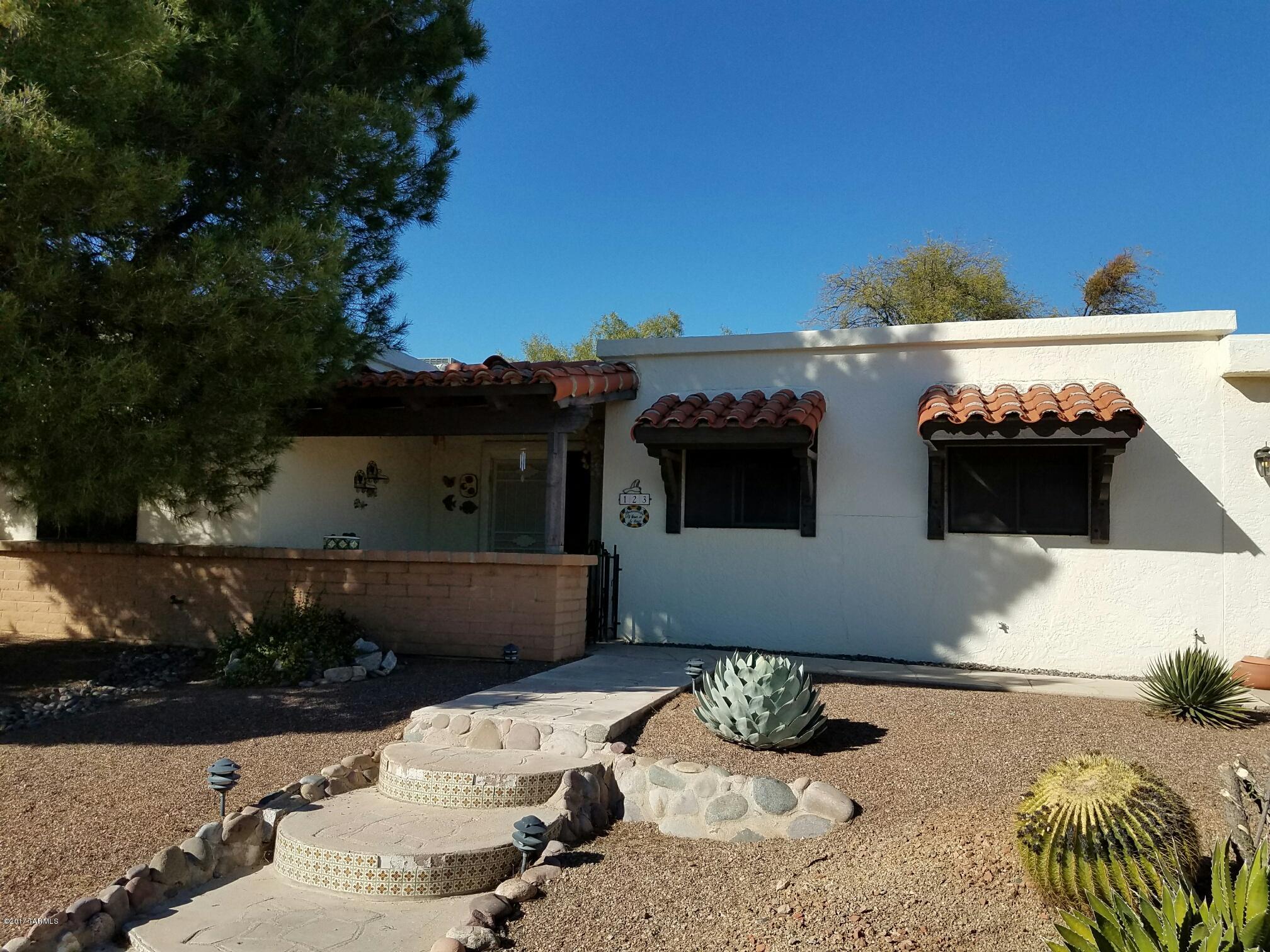 Such a charming home just around the corner from the GV rec center on S Abrego! The home has an amazing view from the front of the Santa Rita Mountains and the back looks out to a wash and has wonderful privacy. Plenty of room inside with a large great room with Saltillo tile and a wall of windows; the dining/gathering room is perfect for entertaining with a ''dry'' bar which includes an under counter refrigerator. The kitchen has been updated with new cabinets and newer appliances; it has a large pantry closet, a desk area, and a cozy eating area. The flooring in the main living area and master bedroom is easy care laminate, the guest bedroom is carpeted. If you are thinking of a part time home, the furniture and furnishings are available! LANDMARK HOME WARRANTY