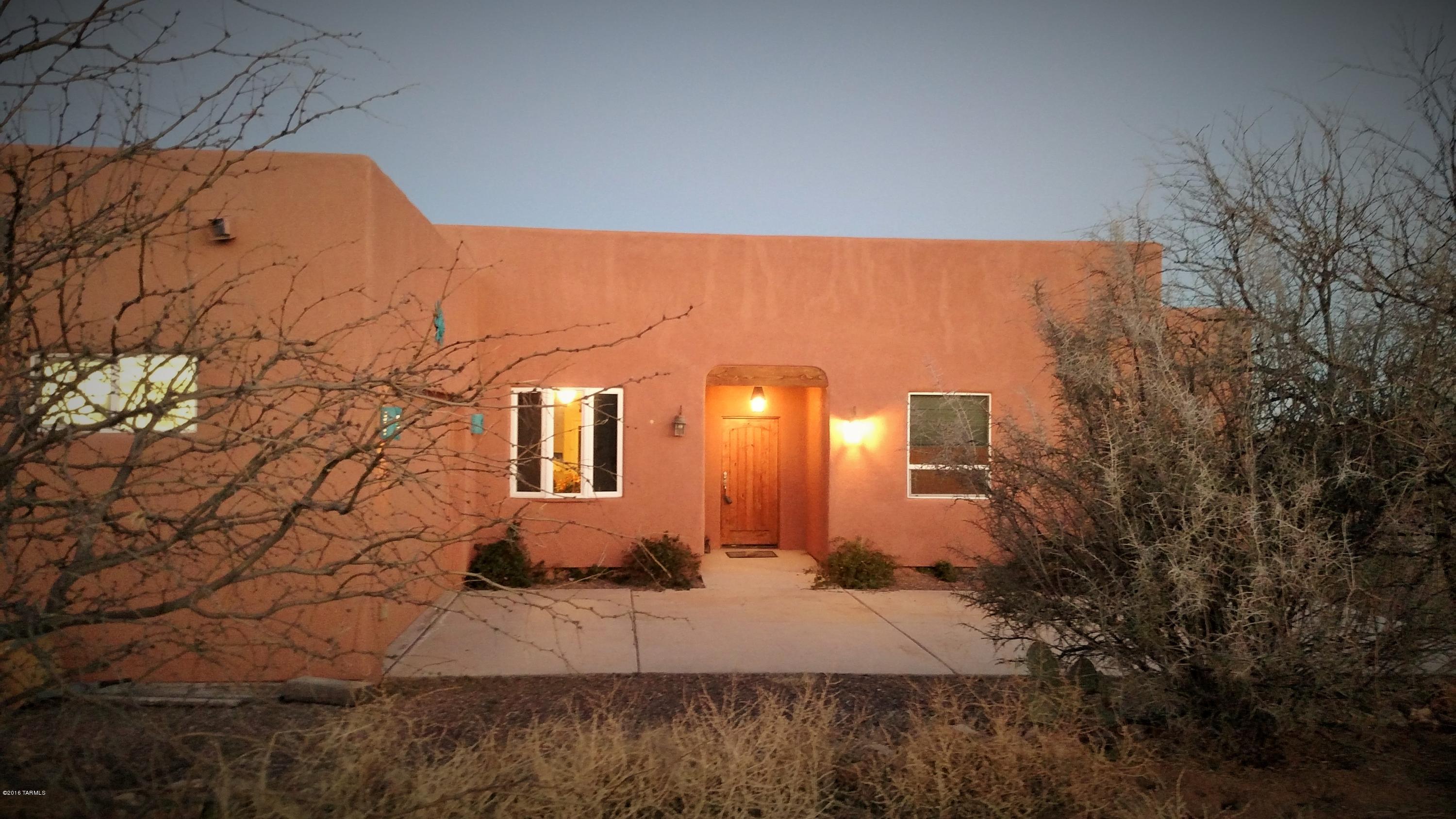 Bordering State Land, this 2007 custom built home on 1.55 acres offers peace and solitude within 20 minutes of Oro Valley. Leave the heat and the city noise and enjoy bird watching, hiking, wildlife, horseback riding and the beauty of Oracle, AZ.  Custom features include open floor plan with 10 ft ceilings throughout the home, custom cabinetry and granite countertops in the kitchen, tall windows and skylights. Tasteful tile throughout the home and freshly painted exterior. Multiple patios to enjoy the outdoors including stunning sunsets. Unique floor plan with office or nursery off of the master bedroom plus a private bedroom, mother-in-law guest room or ''man cave'' off of the garage. You won't be disappointed.