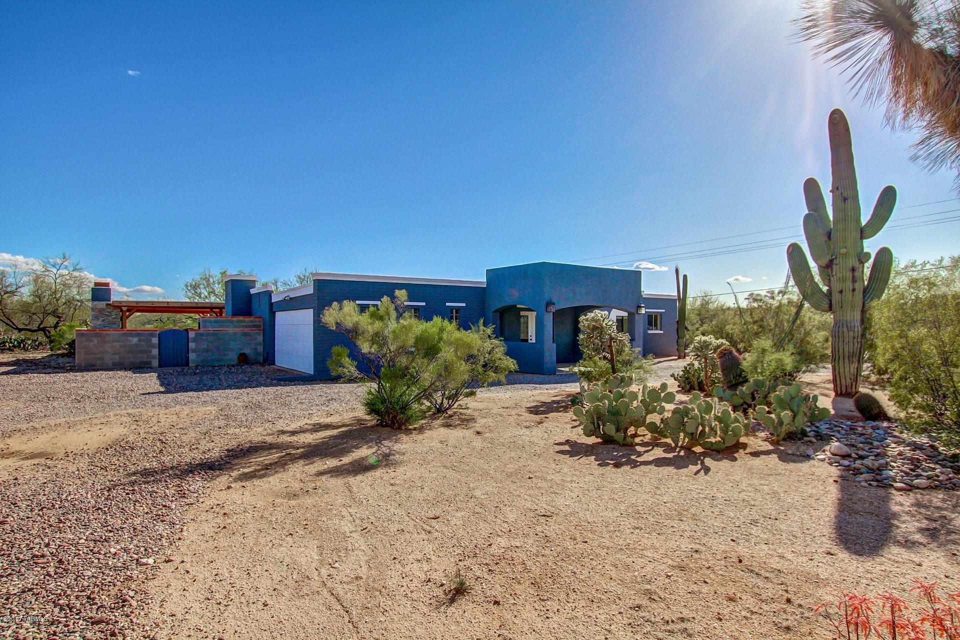 Corner lot on one acre of beautiful desert property.  Where to begin?  A beautiful entry sitting room leads into a fantastic great room and kitchen.  Stainless appliances and huge spans of granite countertops await any kitchen aficionado.  The greatroom offers comfortable living, tiled fireplace, and beautiful views to your outside oasis.  The backyard is a masterpiece with manicured landscaping and a sparkling pool beside a large covered patio.  The custom built gazebo offers the very finest in outdoor living with a BBQ, fireplace, and TV mount!. You truly have to see this one to believe it.