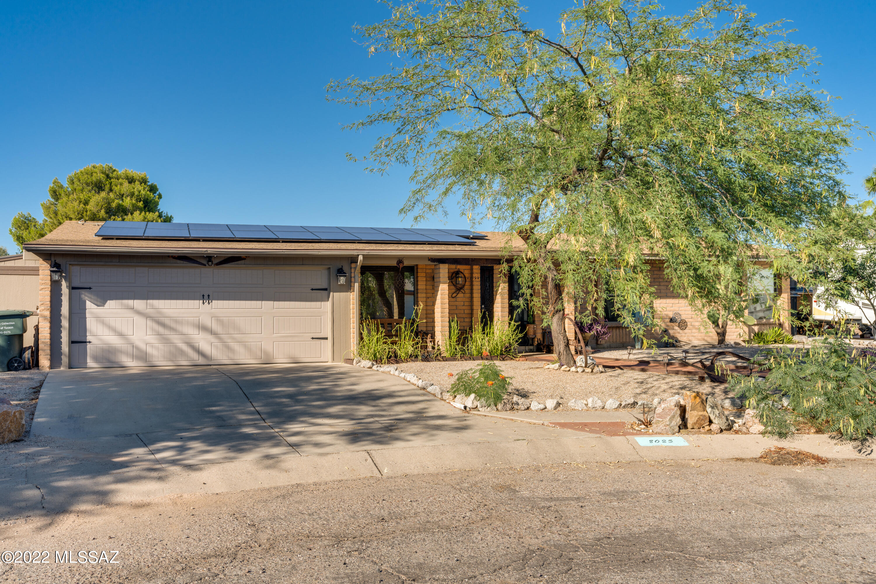 Great east side place with OWNED Solar!! ready for you to call home.  Mature landscaping welcomes you, once inside you will note the new wood-like tile flooring and updated bathrooms. Landscaped backyard with turf and pavers as well as citrus trees. Separate paved driveway for RV complete with RV hook-up. Large storage shed connected to the exterior of the house in the back as well as an additional metal shed adds to the storage of your new home. Roof replaced in 2018.