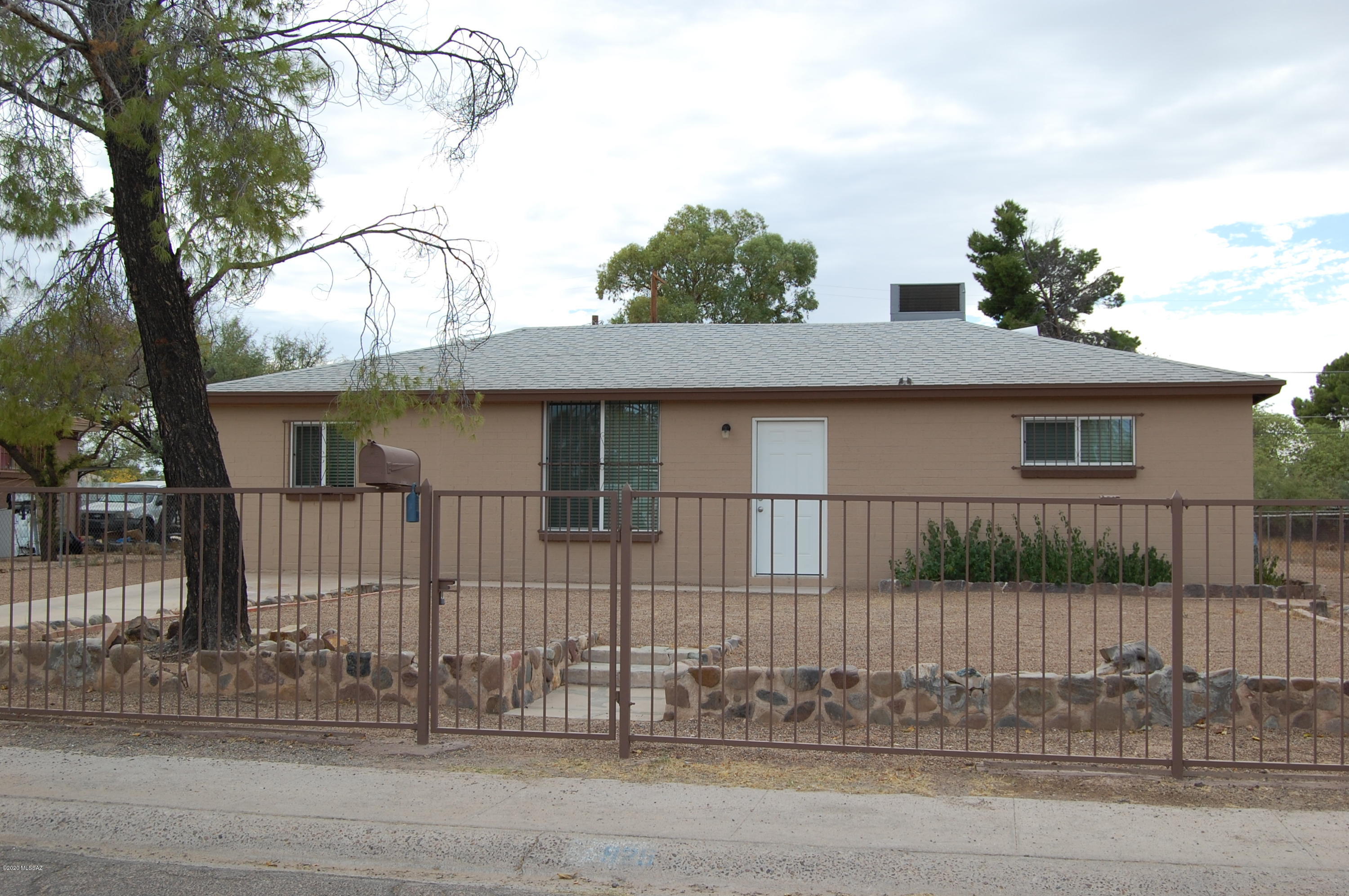Beautifully Redone 3 bedroom 1 bath home on Enormous fully fenced Lot!  Front yard has  Wrought Iron, Back yard is also fenced.  New HVAC, New Two-Tone paint inside and out, New Window's, Some new doors, New Blinds, New molding, New Ceiling Fans, His and Her's closets in Master Bedroom, New Gorgeous Tile, Panel Upgrade, New stainless Steel Appliances including Beautiful Gas Range, New Gas Water Heater, large exterior Laundry room, Beautiful Pea gravel!