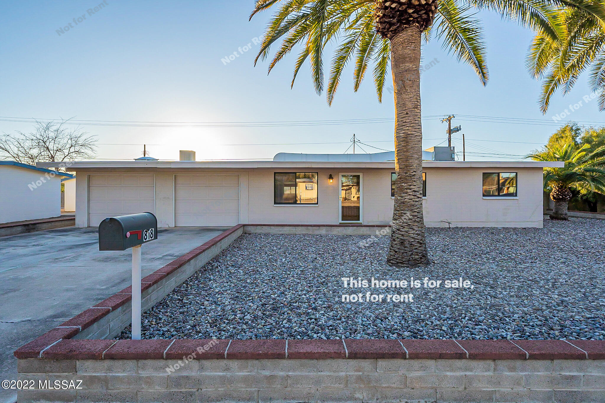 This Tucson one-story home offers an in-ground pool, a patio, and a two-car garage.