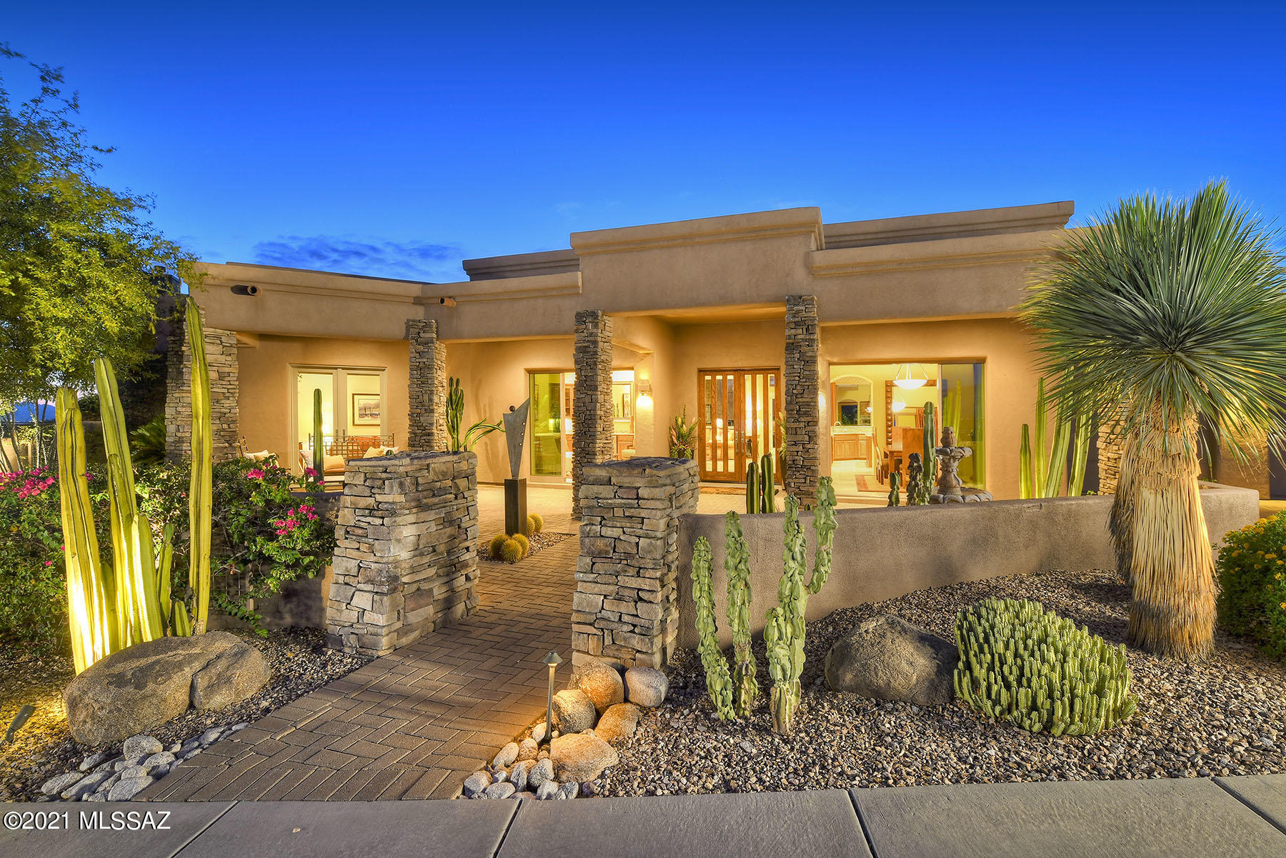 Welcome to this casually elegant, masterfully designed single story custom home. Inviting landscaped private front courtyard w/ stunning panoramic mountain vistas & twinkling city lights in prestigious gated Sabino Mountain. Foyer leads to living & dining areas w/ completely retractable doors taking advantage of every view. Kitchen has premium finishes w/ granite counters, high end stainless appliances w/ subzero fridge, viking 6 burner cooktop, double ovens, wine fridge, prep sink, large island walk-in pantry & built in desk area. Open gathering room off kitchen w/access to outdoor kitchen & backyard. Stunning owner's retreat w/ large sitting area, walk-in closet & windows to enjoy views of the Catalinas. French doors take you to the negative edge pool & bubbling spa. Please see more tab Spa like bathroom with jetted tub, oversized shower w/dual shower heads & bench, fireplace & double sink.
No steps in home. All bedrooms have patio access & walk-in closets & 3 bedrooms w/ensuite baths.
An ideal entertaining space throughout the entire home. Builtin outdoor kitchen w/ bbq, sink & fridge. 3 car garage  Incredible location minutes from Canyon Ranch, Sabino Canyon, World-Class Golf Resorts, Schools, Restaurants and Shopping.