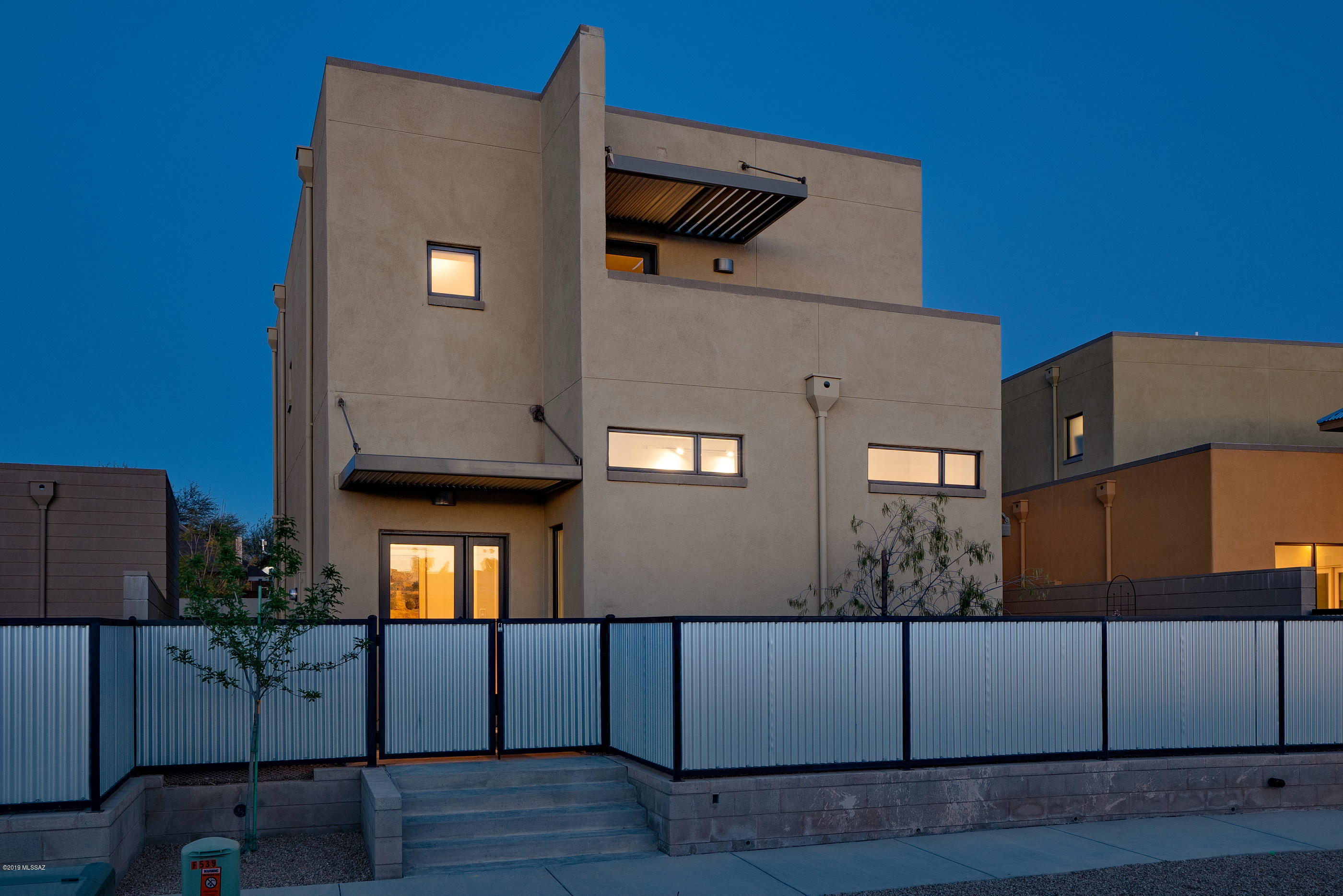 Located within Mordasini Villas, a collection of seven newly constructed residences that seamlessly integrates within the existing fabric of the Barrio Viejo community, and within walking distance of all that the downtown corridor has to offer. Enter through a private courtyard into the thoughtfully appointed interior, featuring a classic palette of materials that appeal to both form and function. This dynamic multi-level home offers subtle integrative elevations, adhering to and complimented by a higher standard of construction, using progressive building techniques and materials, down to the smallest detail. Constructed of solid Insulated Concrete Form (ICF) walls, the design vernacular attempts to integrate and mimic the scale and timeless feel of the surrounding neighborhood. Overlooking a private central courtyard stands the great room, with its sleek white walls and hints of material accents taking shape over the polished concrete floors. A mix of complementary materials, with tailored lines that flow together in a sophisticated, yet user-friendly open kitchen concept, featuring stainless steel appliances, honed natural stone counters and custom cabinetry, as just some of the many luxurious materials utilized. The home offers 1,715 sq ft, 2 bedrooms, and 2 full baths.

Designed by architectural firm Poster Frost Mirto, built by Oden Construction and under the direction of a local developer, this collaboration was created to offer an exceptional contemporary infill project, that values unique architecture and is dedicated to creating a sustainable living environment within the urban core of downtown Tucson, Arizona.