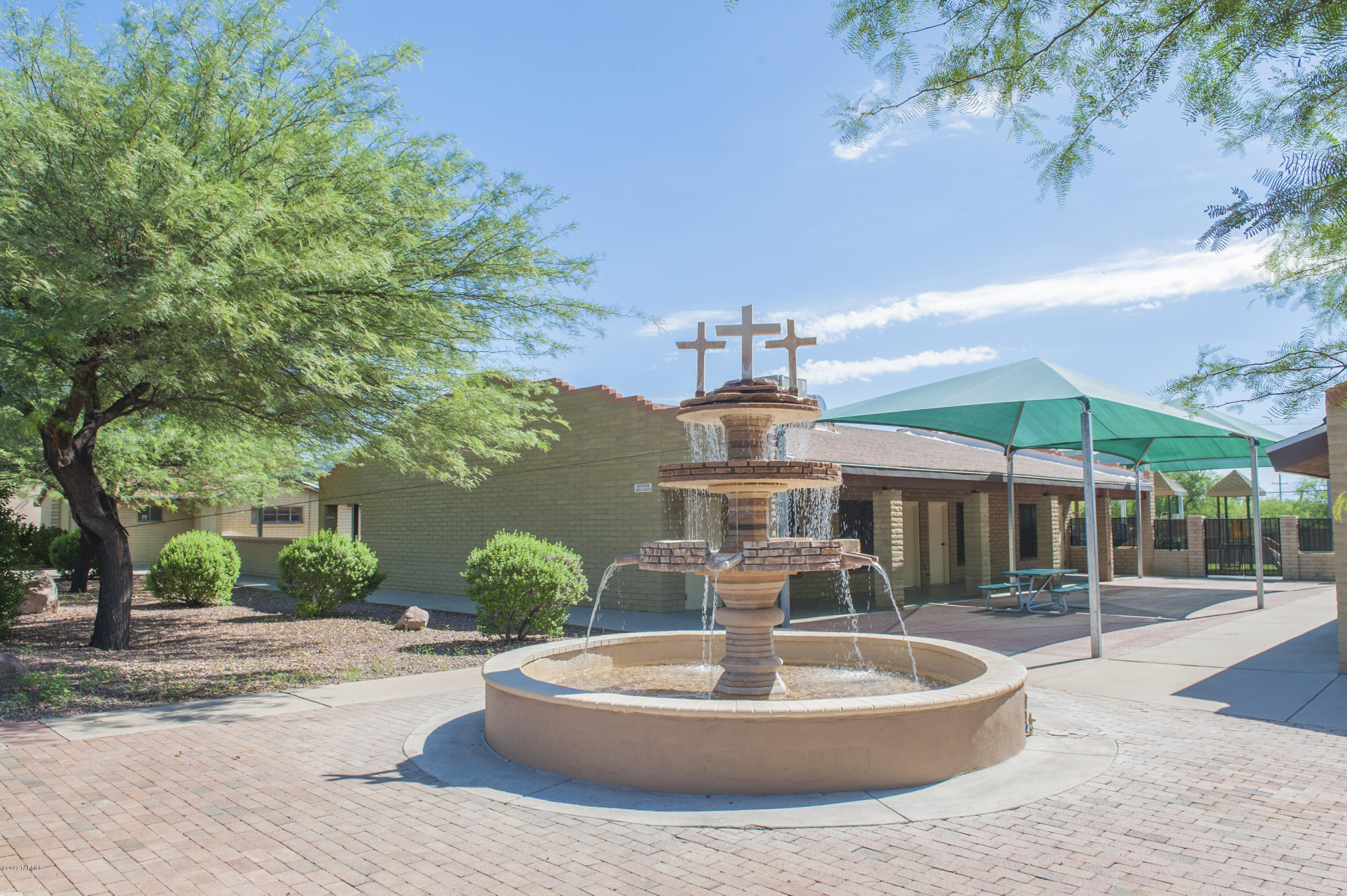CHURCH with over 17,000 sq ft of space with 3 buildings
7,863 sq ft including auditorium that seats 275-300 persons 4 class rooms full kitchen and restrooms
3,240 sq ft comprised of 4 classrooms and restrooms
5,948 sq ft comprised of 5 offices restrooms classrooms and a youth room restrooms and storage areas.
All 3 buildings have AC and heating on approximately 2.03 acres. Shaded courtyard and playground areas including 125 paved parking spots