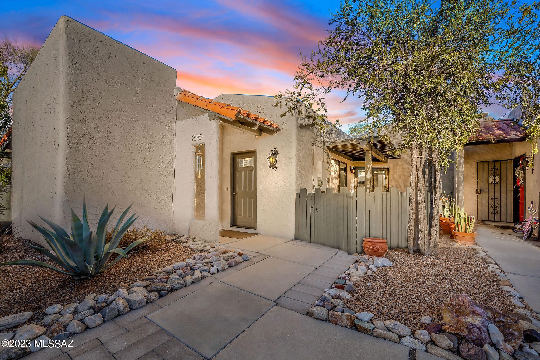 Amazing opportunity for move in ready 1,670 SqFt, 2 bedroom/2 full bath plus den single story, no stairs/steps, townhome with Catalina mountain views located in desirable La Casita Foothills Estates in North Tucson. Situated at end of quiet cul-de-sac, next to a wash, E/W orientation, 3 covered patios to enjoy tranquil Tucson sunsets or watch the monsoon storms roll in over the Catalina mountains.
$260 HOA monthly dues include: 2 community pools, including heated pool, spa and clubhouse adjacent to property. The HOA covers exterior painting of the home, wood (incl fencing) and metal light fixtures, trash service, landscaping, 1 reserved covered carport (#4560) directly in front of property, 1 reserved uncovered space (also labelled #4560) plus additional shared guest parking spaces. Insid buyers will appreciate updated energy efficient, low emissivity double pane Milgard windows (2022) throughout and Pella slider door (2020) with built in blinds inside, motorized luxury Hunter Douglas sheer blackout shades on remote controls, window screens, copper plumbing, Luxury Vinyl Plank (LVP) flooring, new carpet (2023) in bedrooms and den, skylights, lighted power solar tubes, recessed lighting, LED lighting, custom California Closets organizers in all bedrooms and ample storage closet, gas HVAC (has been serviced 2X a year by HVAC company), digital Honeywell thermostat, gas hot water heater (2018), water softener, internal laundry washer & dryer convey, crisp white 6 panel internal doors, painted wood trim, rubbed bronze modern door handles, Moen bathroom fixtures, modern rocker light switches, ceiling fans, spacious living room w/gas fireplace, track lighting, formal dining area, wood serving bar adjacent to updated kitchen boasting damage resistant Corian countertops, modern white kitchen soft close cabinets/drawers, under cabinet lighting on remote, lower level cabinets equipped with pull-outs, stainless steel appliance package including fridge (2020), dishwasher (2022), built-in-microwave, GE electric stove and undermount double kitchen sink w/garbage disposal beneath garden window providing great natural light. Spacious bedrooms, updated full guest bathroom w/skylight and updated modern vanity, den off living room could be converted to 3rd bedroom (just missing a closet), mountain views from both bedrooms, spacious walk-in closet, private ensuite full bathroom with dual sink matching modern vanity. Enjoy low maintenance, private backyard from multiple covered patios on pavers, storage shed, and irrigation drip system (2018). Located in vaunted Catalina Foothills School district with a 68 Walk Score and 93 Biker's Paradise, walk to Catalina Foothills High School, groceries, shopping and restaurants, close proximity to Sabino Canyon National Park, paved Rillito River Park Trail part of 131 mile paved bike path called "The Loop" and a short drive to U of A. Roof recoated Oct 2022 $4400 with transferable 5 year warranty, HOA does not allow short term rental shorter than 3 months, this updated home is ready for new owners to enjoy both year round or as a seasonal retreat!  There are 15 documents available in MLS including floor plan, disclosures, HOA addendum and Covenants, Conditions and Restrictions. Call to make your appointment for a private showing today.