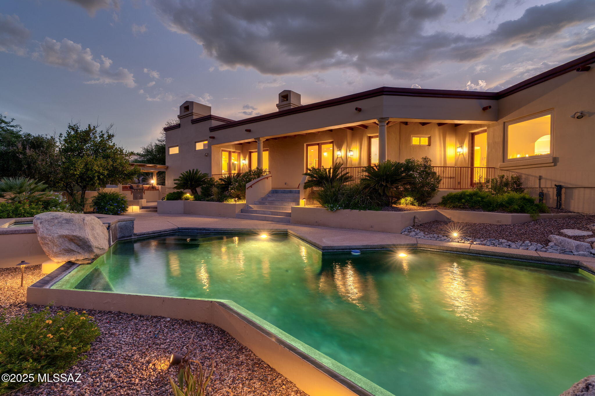 ***MOTIVATED SELLERS***
50K PRICE REDUCTION

Located on a premier 1.03-acre parcel in the prestigious enclave of Hacienda del Sol Estates, this exquisite 4-bedroom, 3-bath residence captures sweeping views of the Santa Catalina, Rincon, and Santa Rita Mountains, along with twinkling city lights that stretch into the horizon.

Designed with timeless sophistication and effortless livability, the home showcases a bright, open floorplan filled with natural light and enhanced by dramatic wood-planked, beamed ceiling. The newly renovated chef's kitchen is truly the heart of the home, appointed with top-of-the-line GE Café Series appliances, dual oversized center islands, elegant marble countertops.  The nearby laundry room boasts matching cabinets for a seamless, sophisticated look Step outside to a private resort-style oasis where luxury meets leisure. A sparkling pool and spa, a full outdoor kitchen beneath a custom pergola, and multiple lounging areas invite you to entertain under the stars or simply unwind in serenity.

The garage is a showpiece of its ownclimate controlled with dual split systems, tiled flooring, and designer cabinetry, offering a highly functional and finished space for car collectors, creative pursuits, or a luxury gym setup.

This extraordinary estate offers the rare combination of location, design, and breathtaking vistasan unparalleled lifestyle experience in the heart of Tucson.