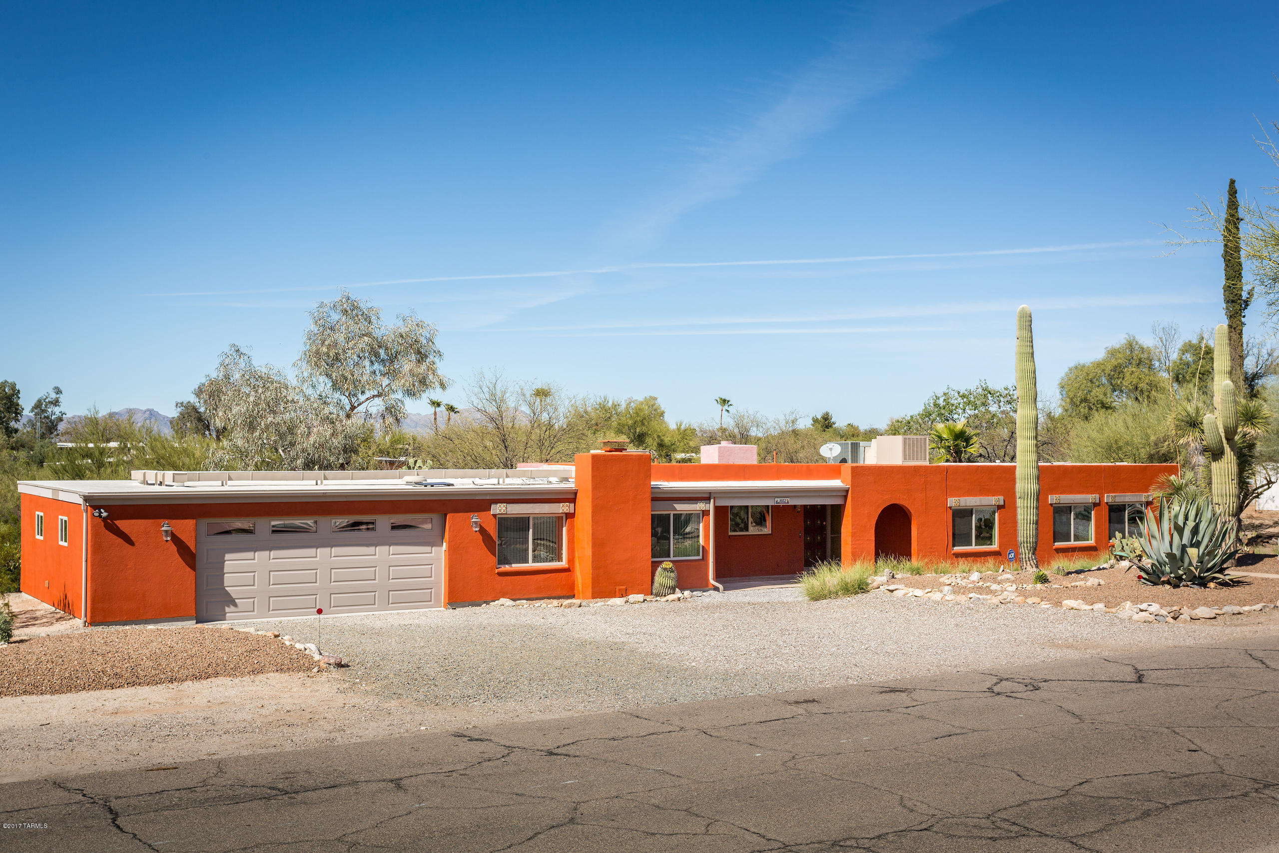 A tremendous opportunity to own a great home in a highly desirable area in NW Tucson.  Privacy galore and a Pool to boot.  Right at an acre of lush desert landscaping and an RV hook up for the visitors.  The area is well maintained and the home has all new paint, newer AC, new roof (2016), new carpet and great washer/dryer included as well as all appliances.  Plenty of space to have a home office, kids rooms, or just a place for you to have space for you.Current owners have maintained and kept up tremendously.  The garage is a 28x28 workshop/car persons dream.  It housed their truck, boat and a storage trailer.  They had it custom built for the toys or cars/trucks.  The pool and back yard are a relaxing get away.  Come take a look today as at this price and condition it will not last long.