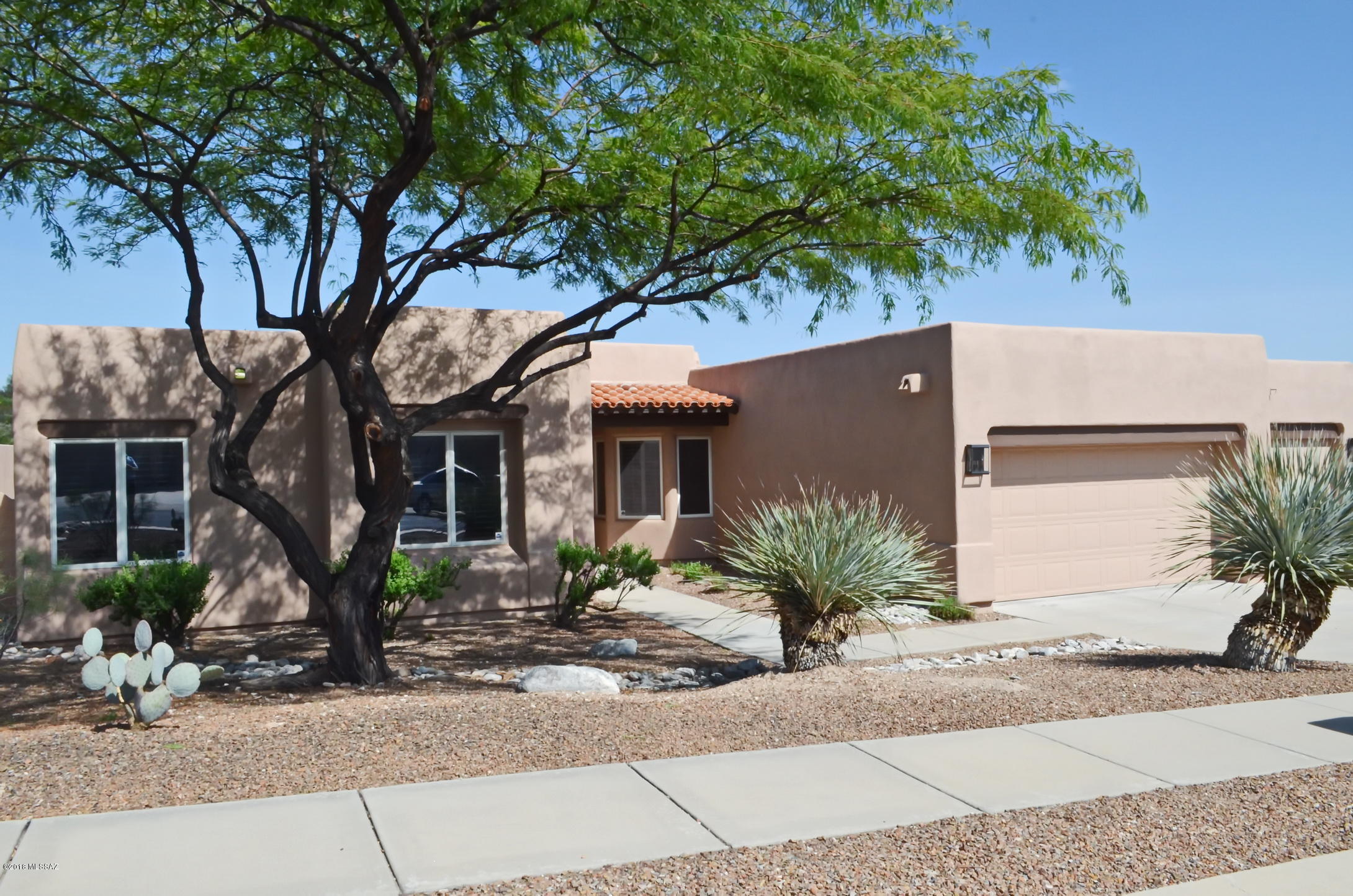 Wonderful newer Doucette built four bedroom, three bathroom, one story, no interior steps, home in the Catalina Foothills School District. Polybutylene plumbing piping replaced. Wood framed Anderson windows and doors and wood shutters. New carpet, neutral ceramic tile, open kitchen to greatroom with gas fireplace, plus a separate living/dining room. High ceilings, fresh interior paint. Investor owned, seller never occupied home, no SPDS will be provided, please include in the purchase contract. Gated community close to all the fabulous Catalina foothills amenities. Mountain and city views from front and rear yards. Very large lot.