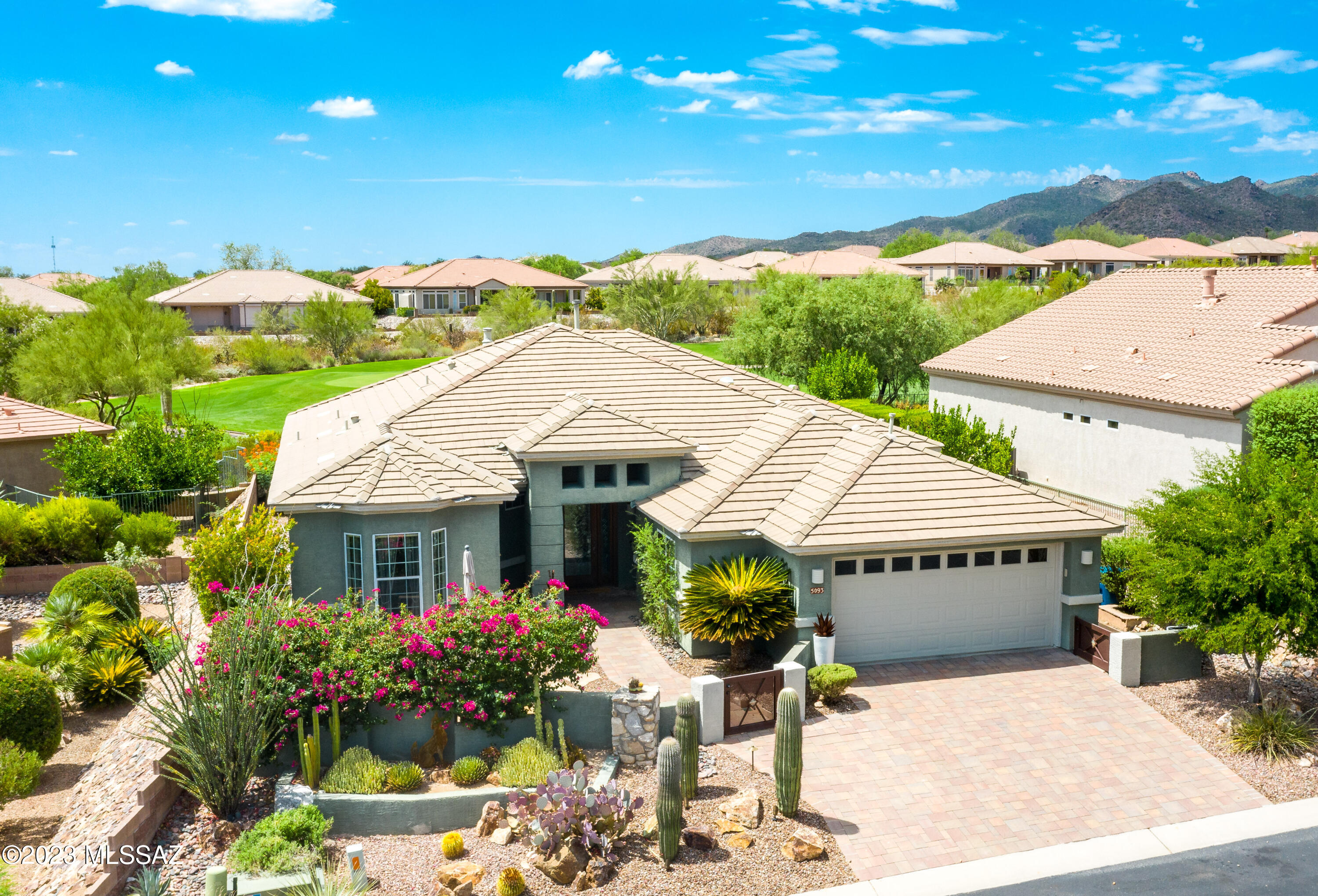 Exquisite highly upgraded Santa Rosa model located at the 1st green of The Highlands golf course. Lovely mountain & sunset views. Beautiful curb appeal-gorgeously landscaped front yard & courtyard. Backyard oasis w/multiple patio & relaxation areas. Luxurious amenities include African slate floors throughout (NO carpet), custom mahogany w/leaded glass entry door, custom fireplace w/mesquite & turquoise inlayed mantle, dry bar in great room. A true gourmet kitchen w/beautiful slab granite countertops & a very customized pantry closet. There is a built in desk system in den/office, Both bathrooms have custom walk-in tile showers & are beautifully upgraded. Whole house H2O filtration system added in 2021 ($3K). HVAC roughly 4 years old w/new remote control thermostat. Golf cart garage, too!