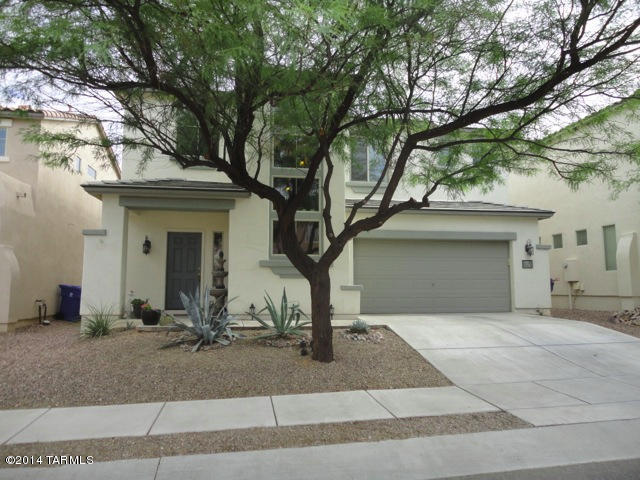 Model perfect home ready to MOVE INTO! This home has many upgrades throughout in this energy efficient Pulte home. Designer colors and open floorplan in this 3 BR plus bonus den downstairs.  Conveniently located laundry room upstairs with washer and dryer included. Easy to care for landscaped backyard with artificial turf and extended patio - all in your entertaining private backyard. Enjoy your master suite with large bath and walk-in closet, 2 more bedrooms with full bath. Located in the award-winning Rancho Sahuarita with walking trails, clubhouse, gym, pools, water park, miniature golf. Call quickly as this one will not last long! Must contact owners directly, it is a MLS only entry. Call 520-205-1938.