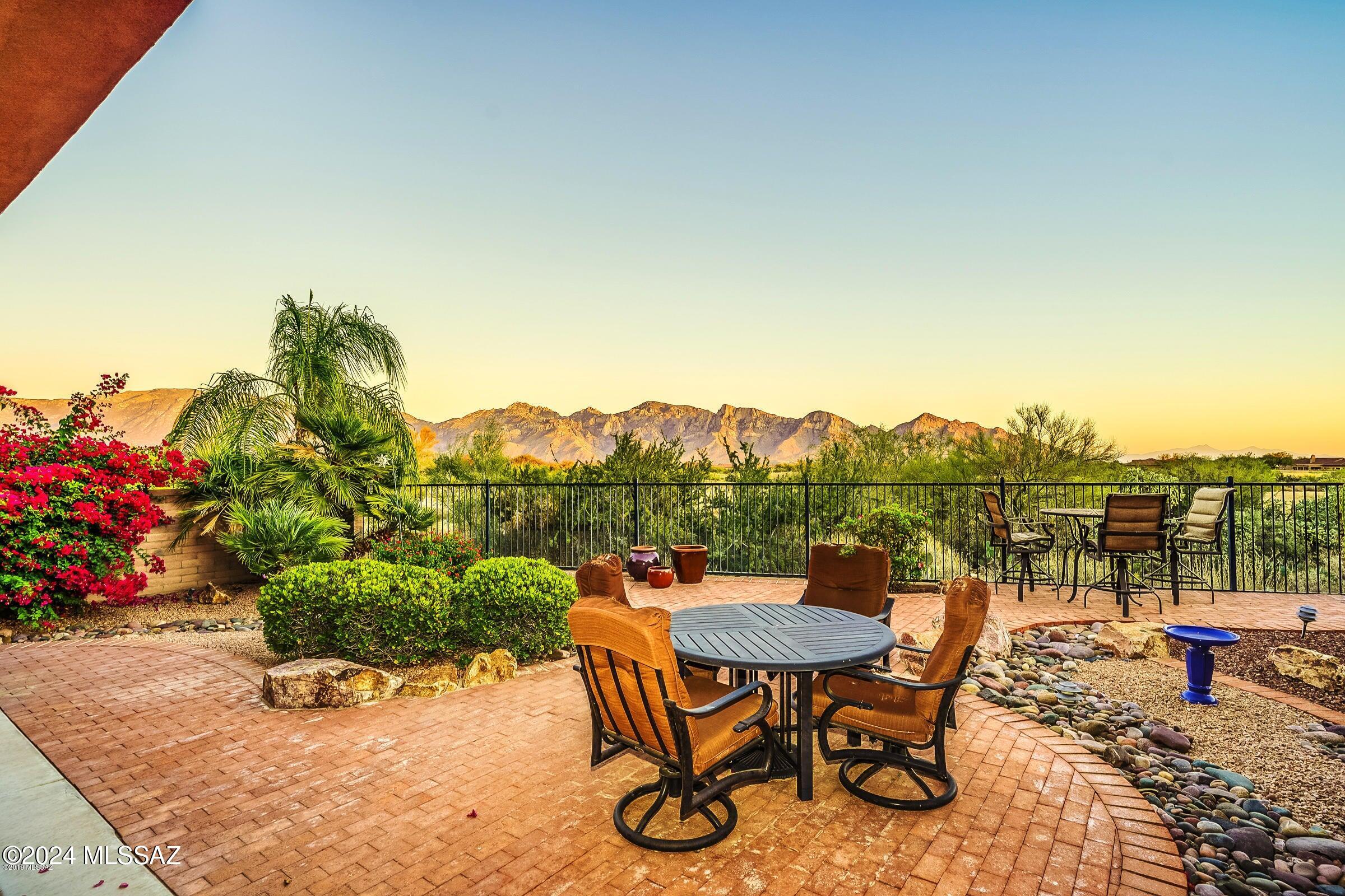 ''ELEGANCE IN THE DESERT''- STUNNING SW CONTEMP THAT OPENS TO NATURE! INCREDIBLE MAJESTIC PUSCH RIDGE VIEWS! SECLUDED ''GATED'' ENCLAVE IN ORO VALLEY- QUALITY BUILT BY FAIRFIELD HOMES! ENTER THE MASSIVE ''GREAT ROOM'' WITH SOARING CEILINGS & WALLS OF WINDOWS/GLASS DOORS BRINGING THE BEAUTIFUL SONORAN DESERT INDOORS!  INVITING ''HUB'' OF THIS HOME OPENS TO KIT/DINING & GREAT ROOM PERFECT FOR TODAYS CASUAL LIFESTYLE! PERFECT BACKYARD ...BOASTS MATURE LANDSCAPING, PAVED PATIOS & UNFORGETABLE MTN, CITY & DESERT VIEWS GALORE!
MASTERFUL DESIGN/FLOORPLAN... EN-SUITE GUEST RM, DEN/OFFICE- POSSIBLE 3RD BR. LUXURY AT ITS BEST- PRIMARY SUITE FEELS LIKE A SPA... OVERSIZED UPDATED SHOWER, SOAKING TUB & 2 WALK IN CLOSETS! GREAT INVESTMENT/ OR VACATION HOME...LOCK & LEAVE!
TRUE GEM
