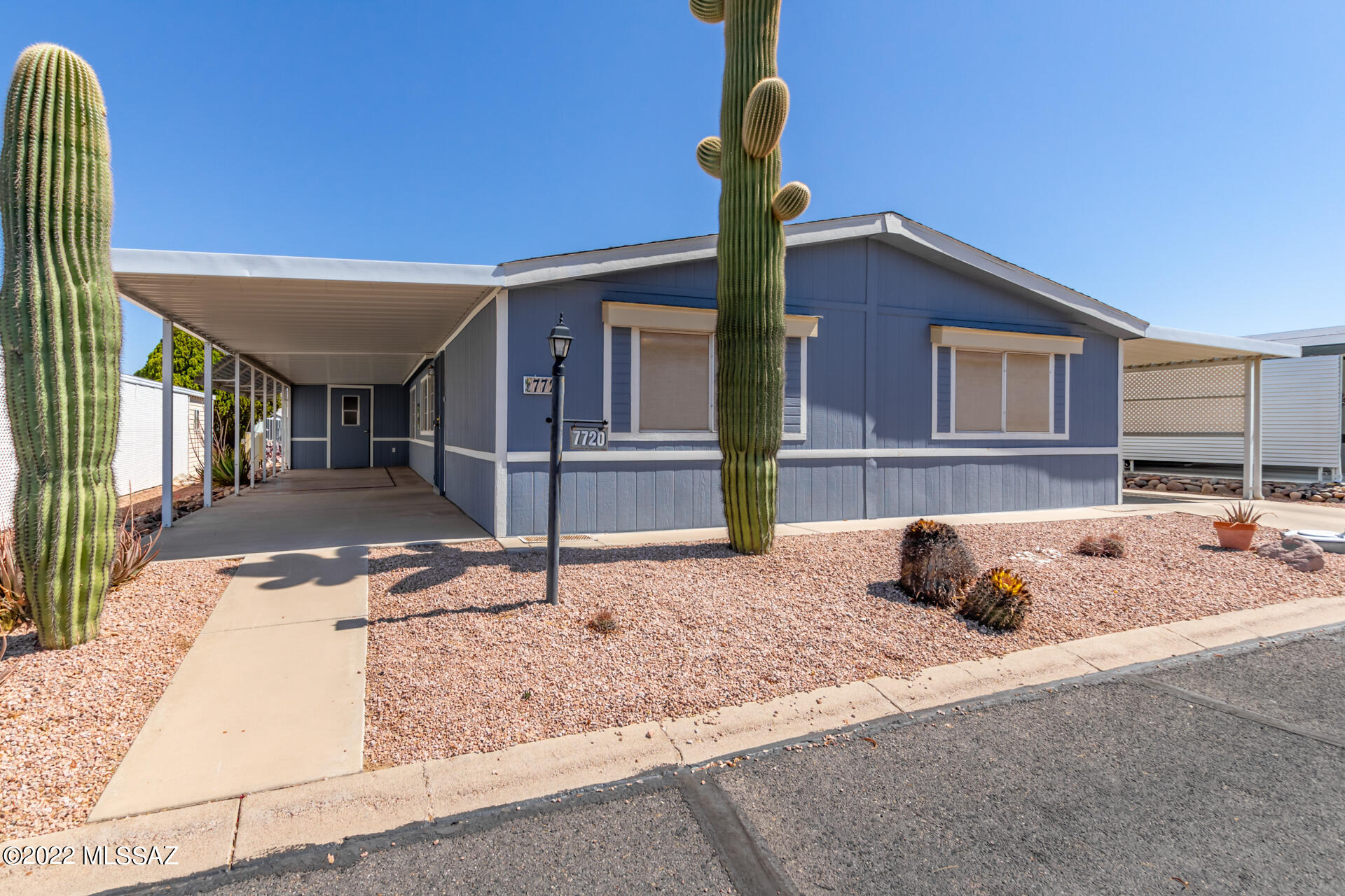 Copper Crest is a 55+ active adult community with tucson mountain park & saguaro national park west as the community's backdrop provides lots of hiking/biking trails. This charming home offers a long carport, spacious porch, citrus tree/easy care yard. Welcome inside to an open floor design w/wood-look flooring, fresh palette, vaulted ceilings, & sizable living room. Enjoy a nourishing feast in the bright dining area! Master your cooking in the kitchen featuring a plethora of wood cabinets, an island, a breakfast room, panty & a peninsula w/a breakfast bar. Relax in the generous-sized main bedroom boasting a private bathroom w/dual sink & walk-in closet. Perfectly sized backyard has a ramada & paver patio. Enjoy Community pool/hot tub, excellent recreational center, so many fun activities!