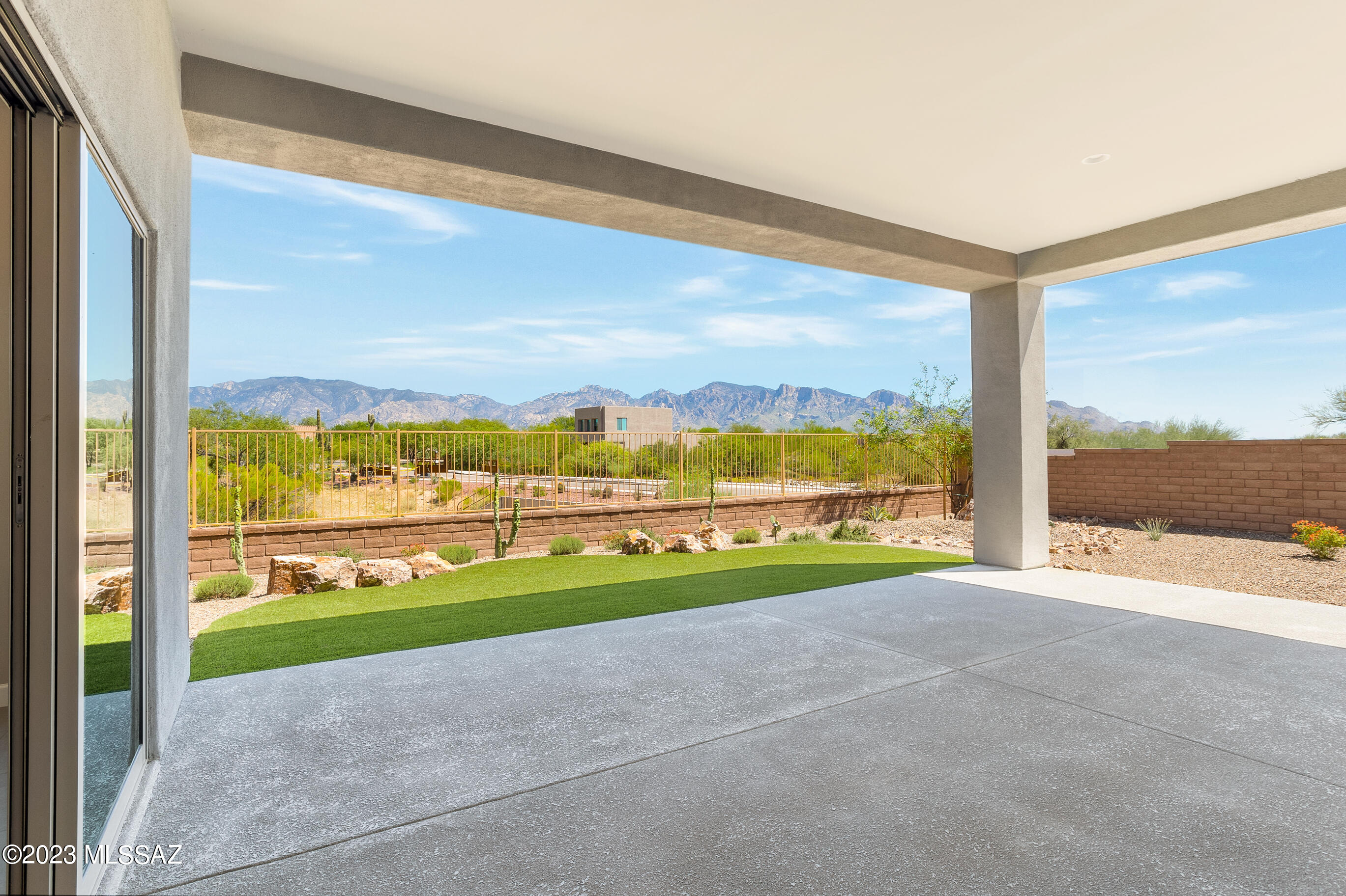 Why wait for new construction? This gorgeously upgraded Builder's Model home in a gated community has never been lived in and is ready for you! Magnificent views of the Catalinas out the back and sunset/Tortolita views out your front patio. Entertainer's delight with 90-degree multiside doors creating additional living space on your Kool Deck covered patio. Primary bedroom with views, dual closets, large walk-in shower and double vanity. Additional bedrooms are en-suite with powder room for guests. Two walk-in pantries plus butler area awaiting your beverage fridge. Built in desk area to keep you organized. Large mudroom and laundry room plus extended 3 car garage. Landscaped yard with room for pool on south side of home. Comes with Builder's Limited Warranty.