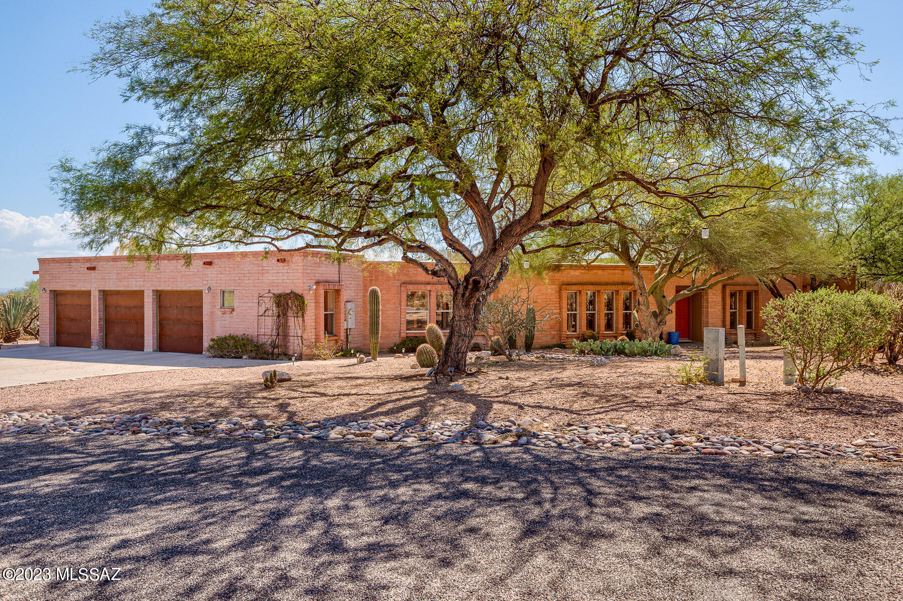 BEAUTUFLLY UPDATED MASONRY TERRITIORIAL IN THE CATALINA FOOTHILLS. 3 CAR GARAGE ON NICE CORNER LOT WITH MTN VIEWS. MATURE DESERT VEGETATION AND TREES SURROUND THIS BEAUTIFUL PROPERTY. BACKYARD HAS A HEATED POOL AND A COVERED DECK. TASTEFULLY UPDATED INTERIOR. GOURMET KITCHEN HAS NEWER CABINETS AND GRANITE COUNTERS W/ GE MONOGRAM STAINLESS STEEL APPLIANCES. A STUNNING NEW WALK THROUGH AREA WAS ADDED FOR REFRIGERATOR AND BAR/PANTRY AREA. 2 PELLA FRENCH DOORS AND  PELLA WINDOWS INSTALLED ALONG SOUTH SIDE OF HOME. TIMELESS HIGH END ENGINEERED HARDWOOD FLOORING IN KITCHEN, DINING AND LIVING AREAS. 2 MASTER BEDROOMS WITH ENSUITE BATHS. 2 ZONED HEATING AND COOLING SYSTEM REPLACED IN OCT. 2022.