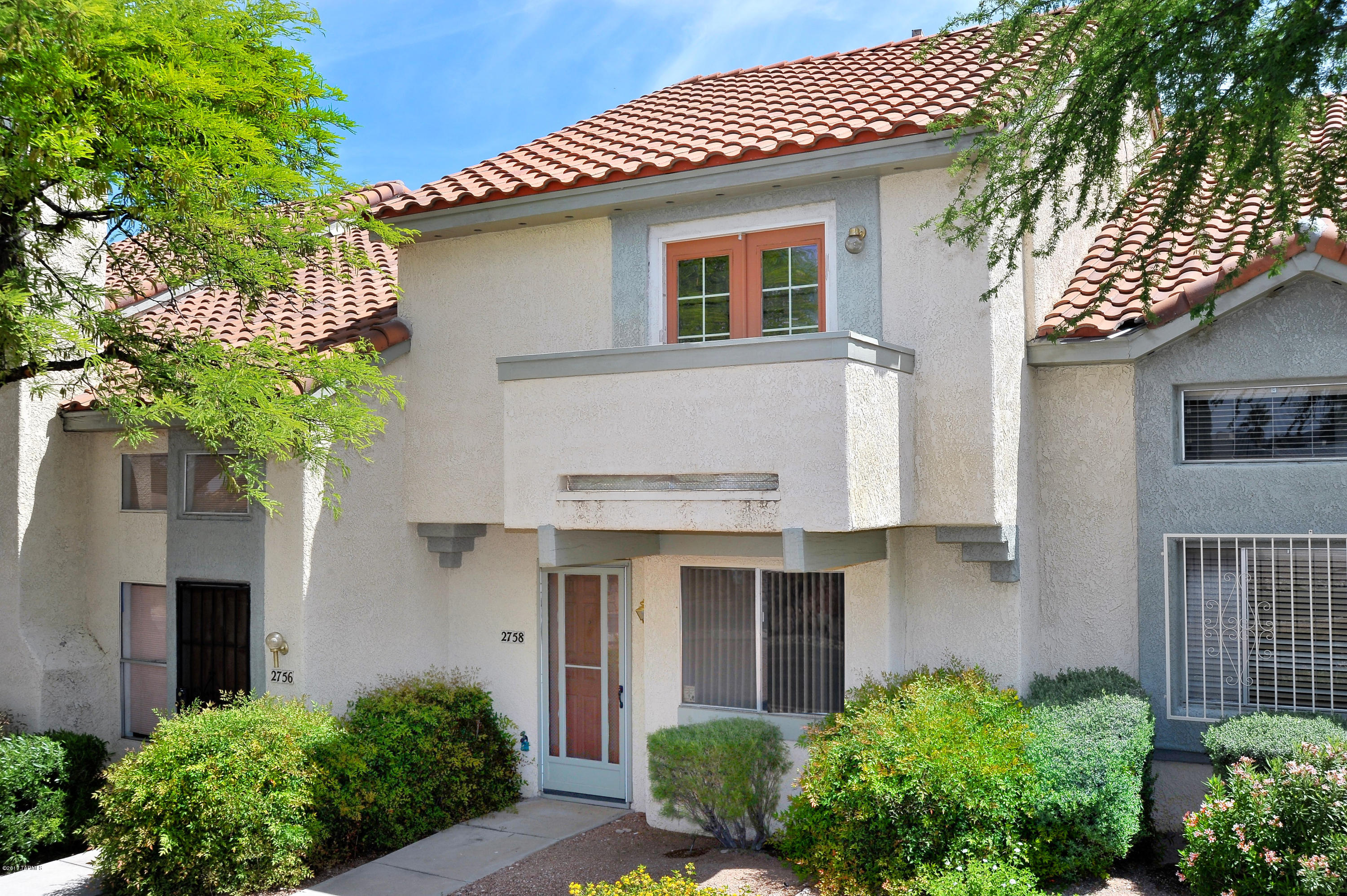 Great opportunity in a quiet, tucked-away community with a private fenced yard. 1195 SF, 2 bedroom, 3 bath townhome features dual master suites with great mountain views. Spacious kitchen with new bamboo wood floors. Brand new carpeting in living room and bedrooms. Cozy fireplace in living room. Private, covered back patio with storage room and access gate to covered parking. Short drive to Pima West Campus, shopping and I-10.  HOA covers community pool, trash, exterior paint, front yard maintenance. Washer and dryer included. Plenty of storage. A one year Fidelity Home Warranty is included. Don't delay!