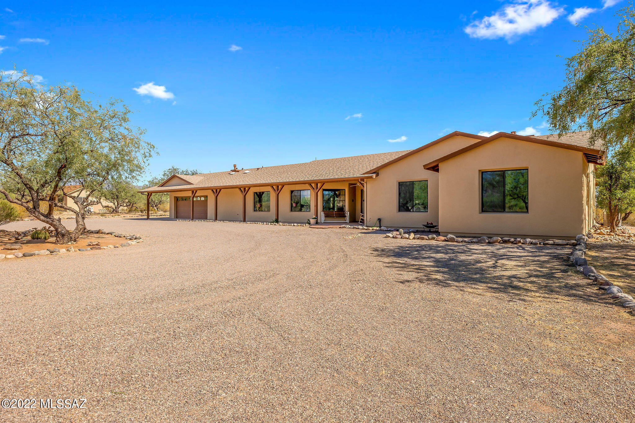 Welcome Home! Enjoy the privacy of your own in town ranch with stunning mountain views! Plenty of room for Horses, RV's & other toys. This home features 3 bedrooms, 2 baths in the main house and separate guest quarters w/ private entrance, kitchen, bath, large great room that's doubles as a bedroom. Fabulous entertaining from the cook's kitchen that looks into the formal dining room, w/ breakfast bar & plenty of storage. Living room features brick fireplace. Family room could be home office. Primary bedroom has large walk in closet, dual sinks in the bathroom and separate shower area. Light and bright bedrooms 2 and 3 are oversized with plenty of storage. Laundry room has salon style sink & room for crafts. Relax on the large covered front porch &watch the mountains change colors. !