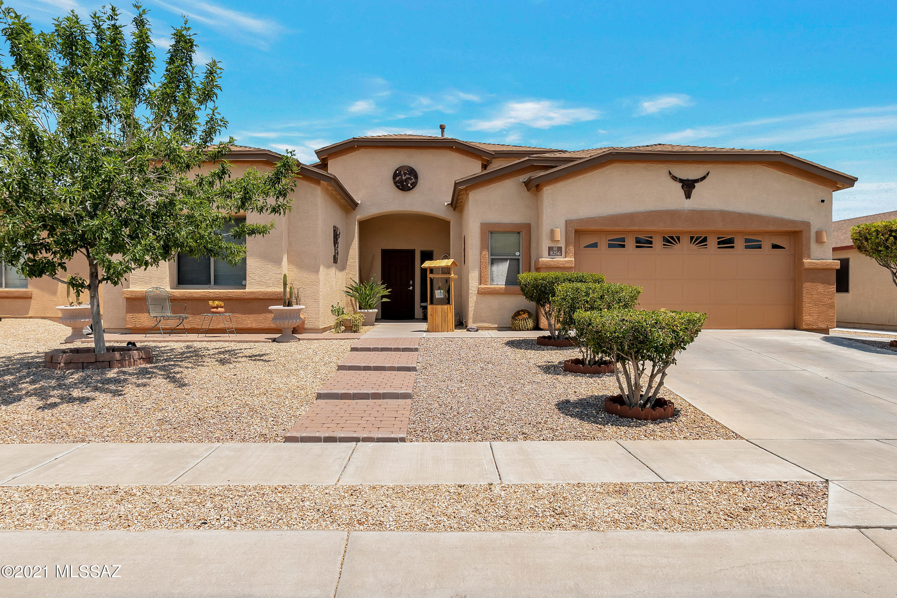 This home shows pride of ownership throughout! It features a stunning entrance onto an open foyer and great room. Large kitchen with extensive cabinets, gas range, built -in desk, breakfast island and closet pantry.  Tile floors in common areas and carpet in bedrooms, tall ceilings and lots of open spaces. Large master suite and master bathroom with dual sinks in vanity, separate shower, garden tub, private w/c and walk in closet. Fabulous back yard with covered patio, pavers, flower beds and gazebo!! The garage is extra wide which allows for storage, it also has built in cabinets.  Super nice!