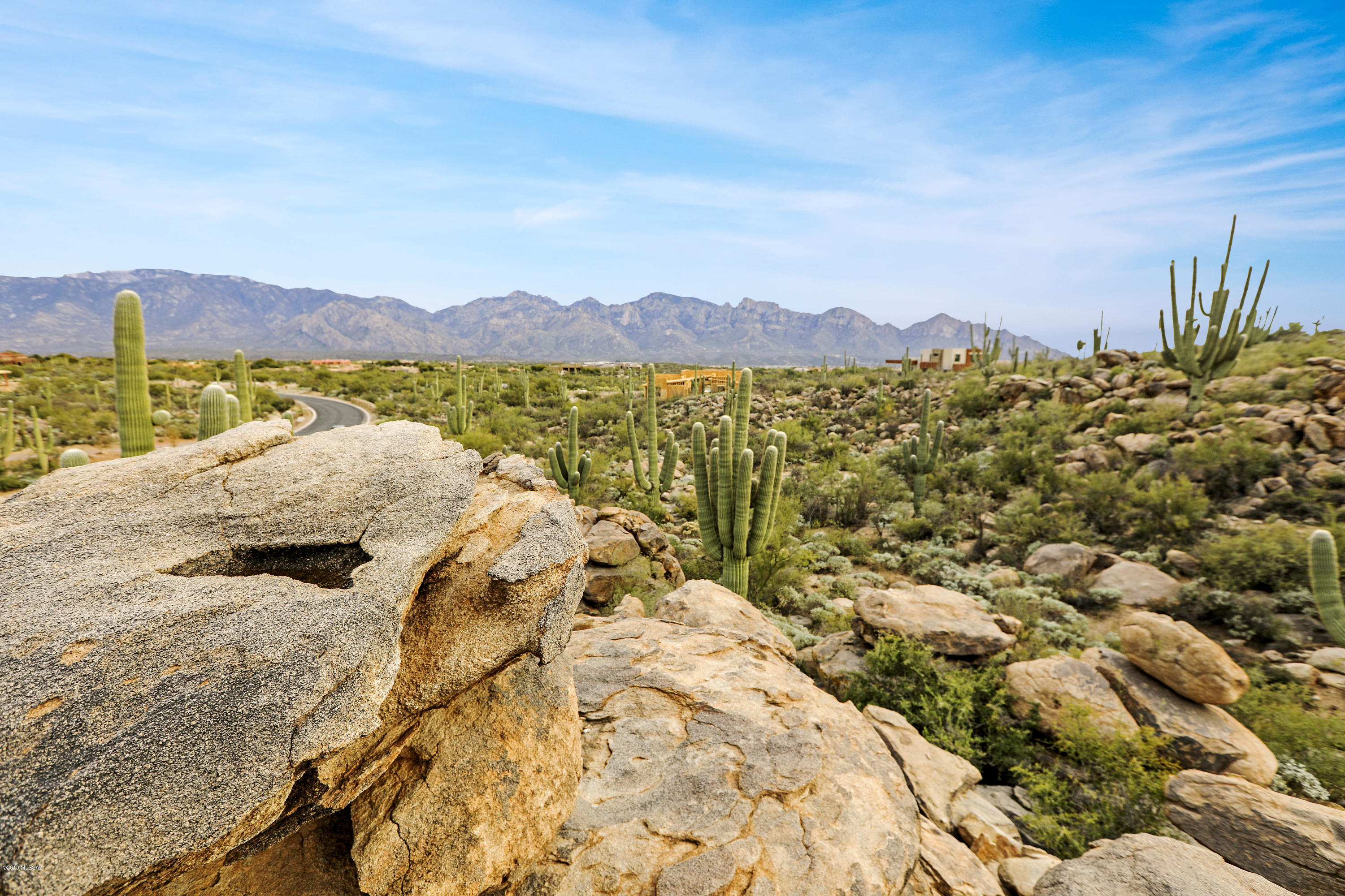 Enjoy our beautiful Sonoran Sunset and natural rock cropping's on this 2.50 acre lot. This lot is located in the luxurious Stone Canyon with plenty of amenities. Golf, Fitness and a private restaurant for our homeowners.