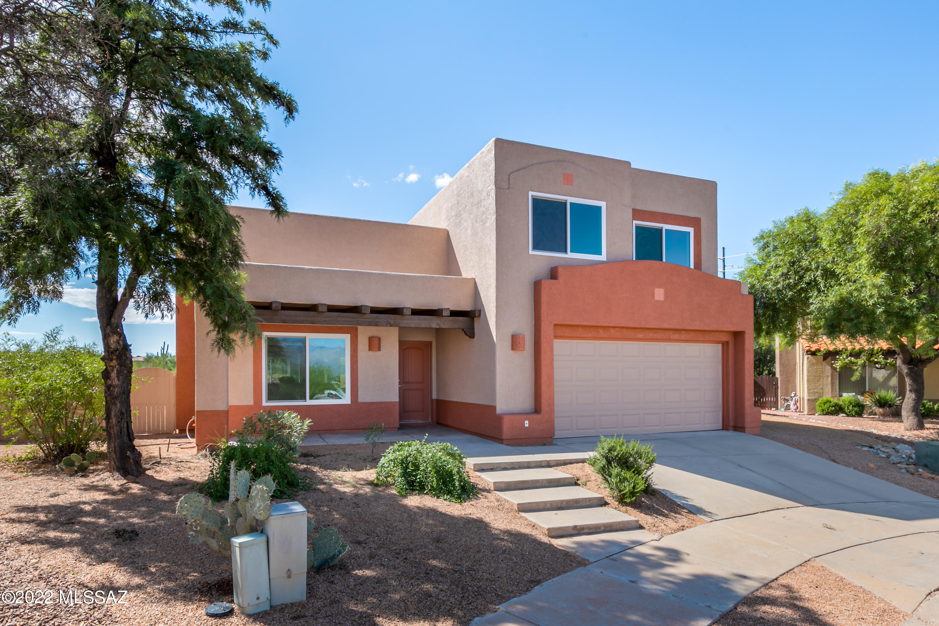 Completely remodeled home in desirable Silverado Hills - you will not be disappointed, NEW: plumbing, HVAC, flooring, doors, windows, fixtures, cabinets, counters, sinks, showers, paint, almost everything. Walk into the inviting living room with floor-to-ceiling stonework and a hand crafted mantel. Kitchen was opened into a great room concept with new cabinets, granite counters, and lighting.  Upstairs the master bedroom boasts amazing Rincon mountain views from inside and outside on the patio.  Master bath fully remodeled with executive height dual vanity and contemporary walk-in shower. Original construction includes 4' extensions on 4th bedroom and on width of garage for additional storage space.