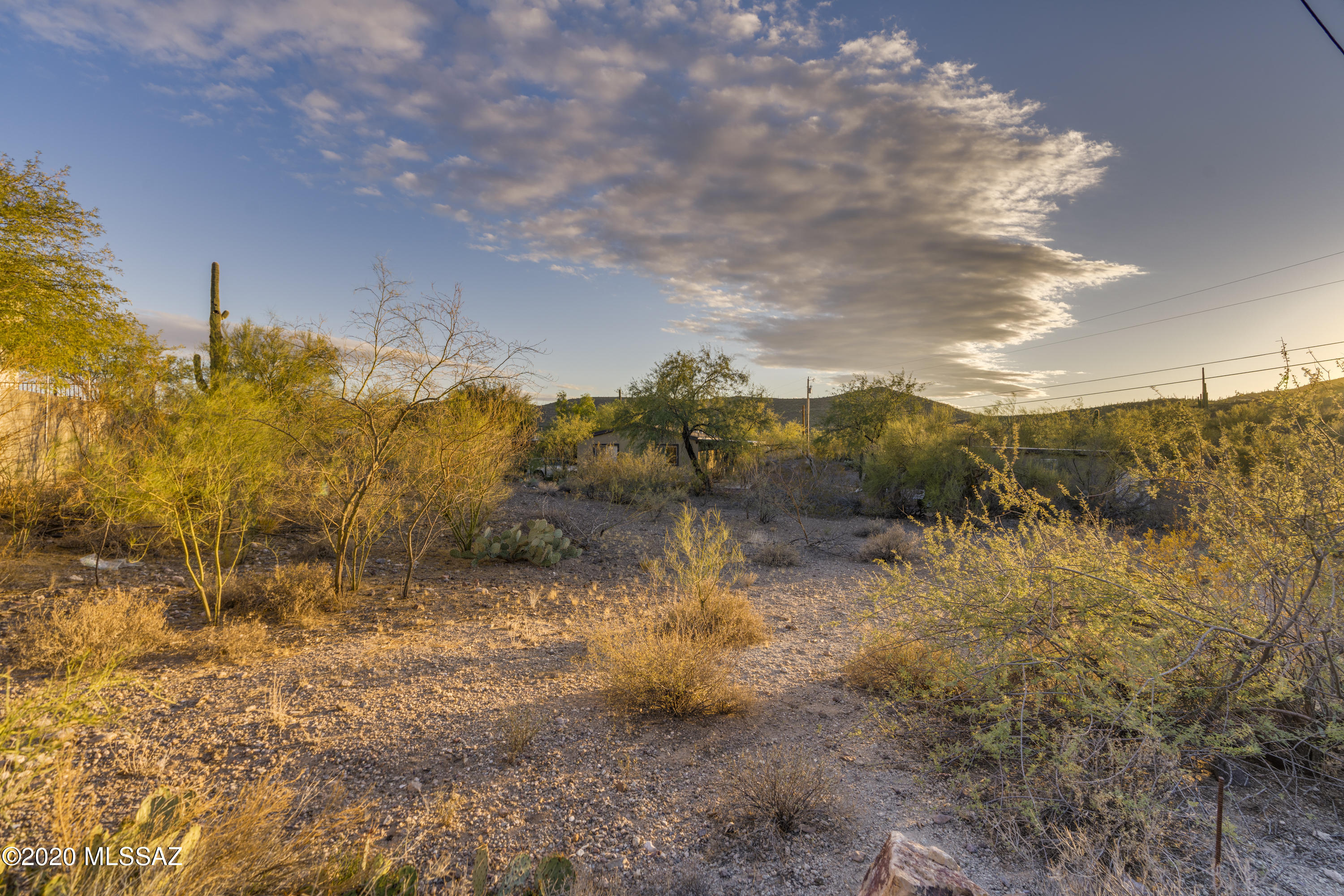 Beautiful lot ready for your custom home in the well established neighborhood of Paradise Mountain Estates. Hard to find infill lot tucked away at the end of cal-de-sac.   Close to Downtown Tucson, University of AZ, St Mary's Hospital and easy access to I-10. Enjoy amazing sunset views or natural desert landscape with current state land to the west of the property.   Enjoy the desert animals, birds and beautiful views. Septic required and not installed.  Home next door also for sale MLS #22102555