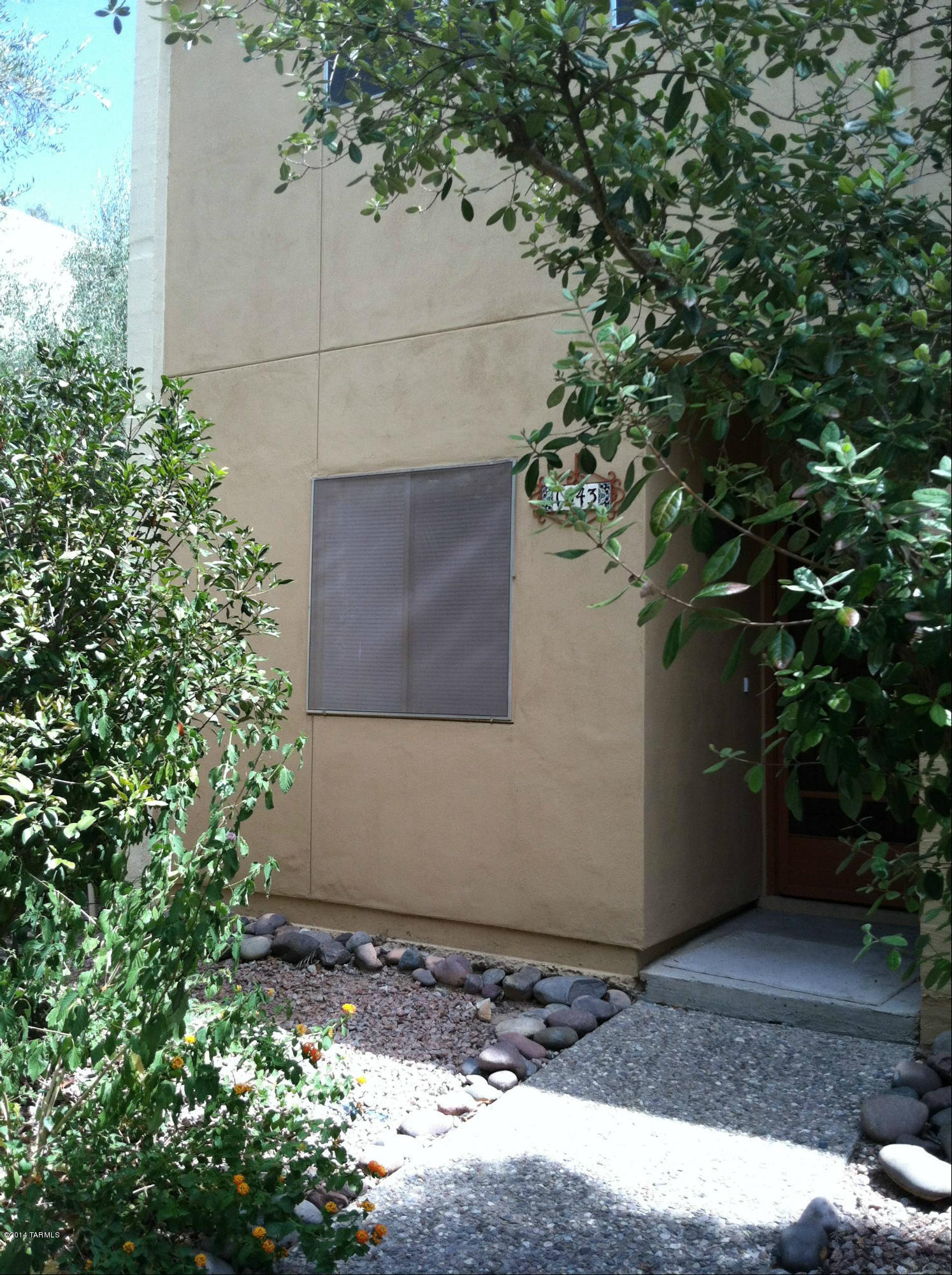 Lovely remodeled condo.  Ceramic tile downstairs, new carpet upstairs.  Living/dining combo, nice freshly painted kitchen with newer appliances, 1/2 bath downstairs.  2 bedrooms with large closets and full bath upstairs.  Nice balcony off Master bedroom.  Washer/dryer hookups, fenced yard, community pool, covered parking.  Fort Lowell / Mountain