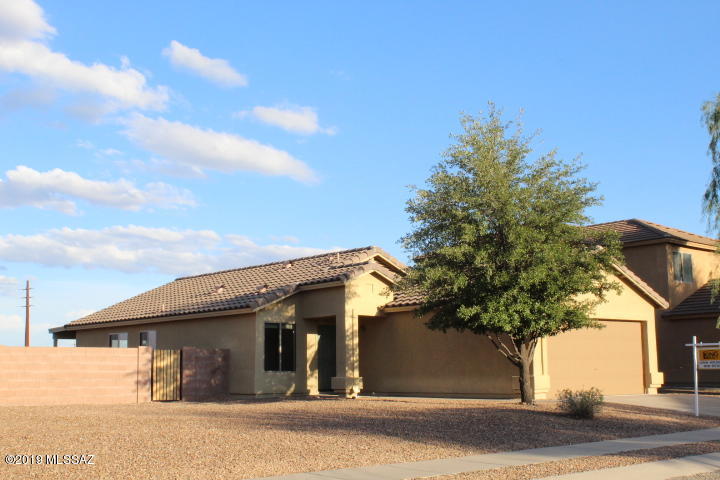 Tucked deep in a super popular west side neighborhood sits a 3 bedroom 2 bath single story home on a spacious lot looking east to the mountains. Tile through out this home. Open kitchen and family room with sliding door out to open backyard and covered patio. Slab in backyard is wired for a spa. Ceiling fans in all rooms. Freshly painted inside. HVAC unit 1 year old. Fresh rock in front and back yards. Come look at your new home.