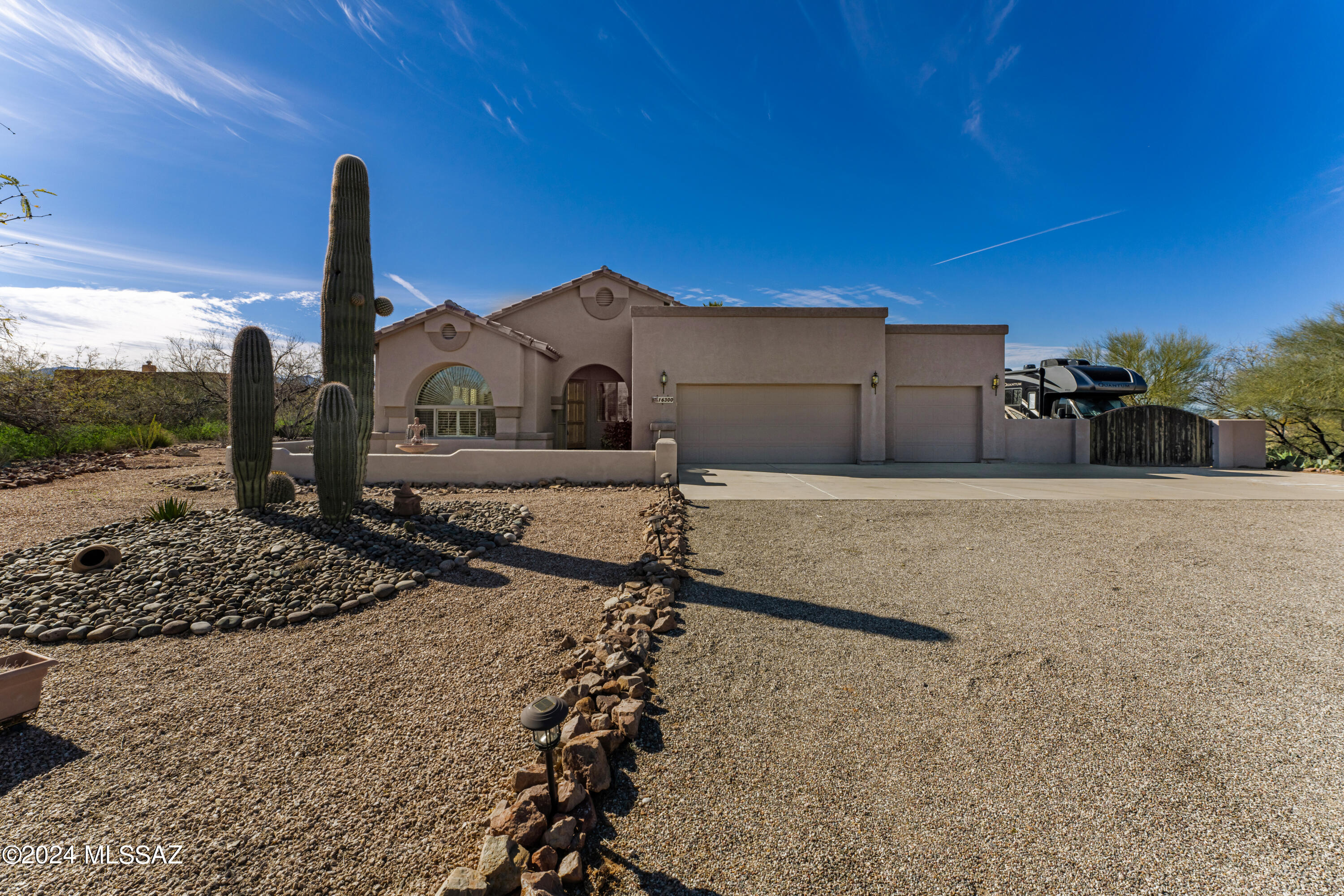 Dream  big! You deserve to get away from busy city and find your way home to quiet gated community . Breathtaking views from your beautiful calm of the world. From the front entrance of driveway to back gorgeous entertaining landscape. Oasis  backyard w/pool for those HOT Tucson days.    New SS appliances in April 2024.  Tons of kitchen counter space and cabinets. Separate den makes for great office or play room. With just over 2 acres, bring your recreational vehicles, room for RV behind double gate. Driveway up to home w/front court yard/fountain. Plenty of room to personalize your own home resort. Upgrade shutters.   New Hot Water 2023. New epoxy patio flooring 2023. Rm for Casita w/approval from HOA.  Bring the family recreational vehicles.  This home has it all. Original owner.