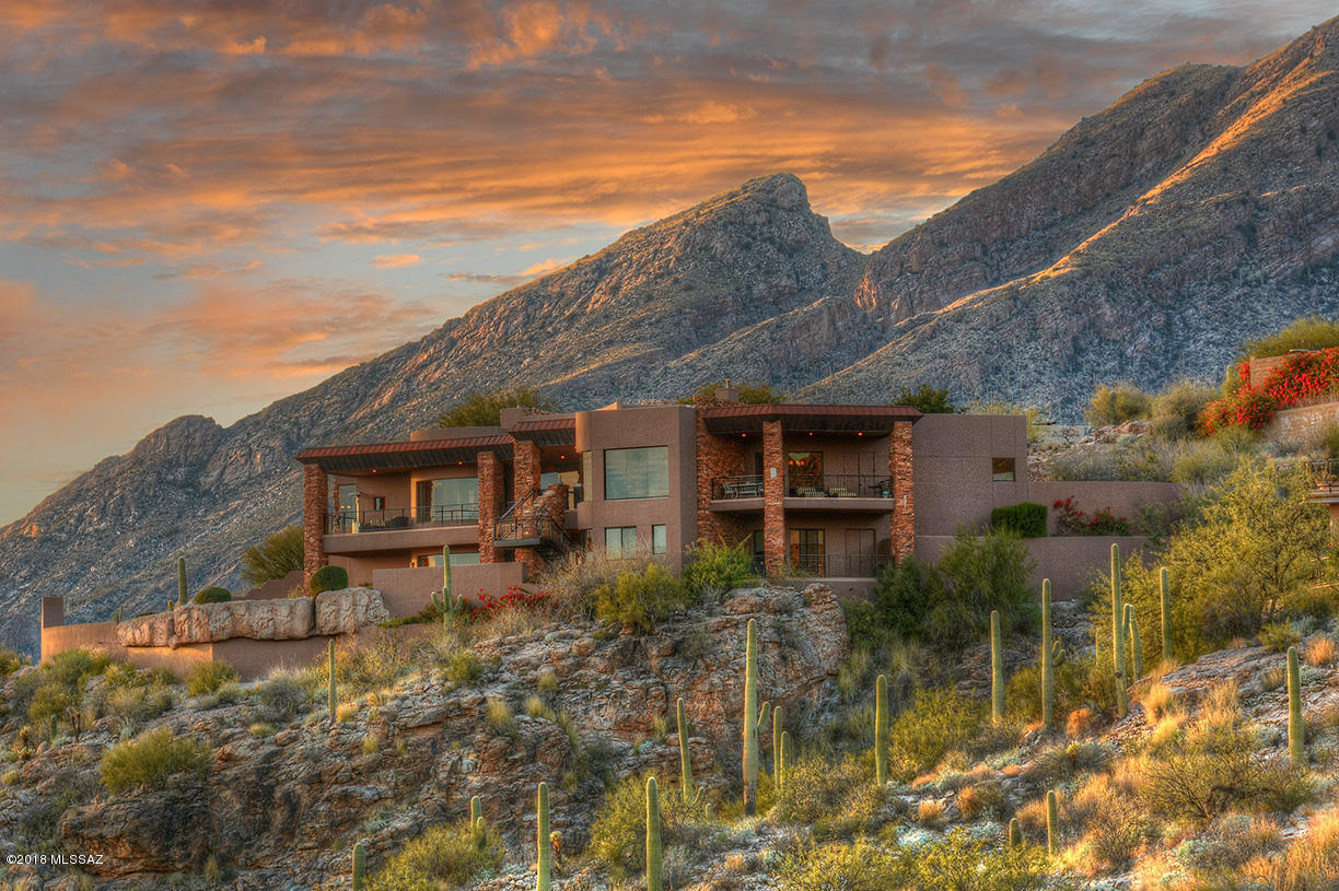 TOP OF THE WORLD VIEWS From This 2002 Masonry Built, Contemporary Home in Coveted Ventana Canyon Mountain Estates. 4 Bedroom & 7 Bathrooms - 6800 Sq Ft - This Luxurious Home Features Fine Finishes Throughout Including Wood & Flagstone Floors, Granite Counter Tops, Stone Fireplace & Wood Ceilings. Other Features Include Floor To Ceiling Picture Windows, Master Suite w/Fireplace, 3 En Suite Guest Rooms and a 5th Guest Room or Executive Office. Spacious Game/Media Room w/ Bar & Walk In Wine Room, 3 Car Garage & Golf Cart Garage, Covered Balconies & Ultra Private Over Sized Outdoor Living Space w/John Stropko Designed Pool & Spa, Covered Dining Area, Fireplace & Unmatched Golf Course, City & Mountain Views! By Far The Best Views Currently Available in Ventana Canyon Mountain Estates!!