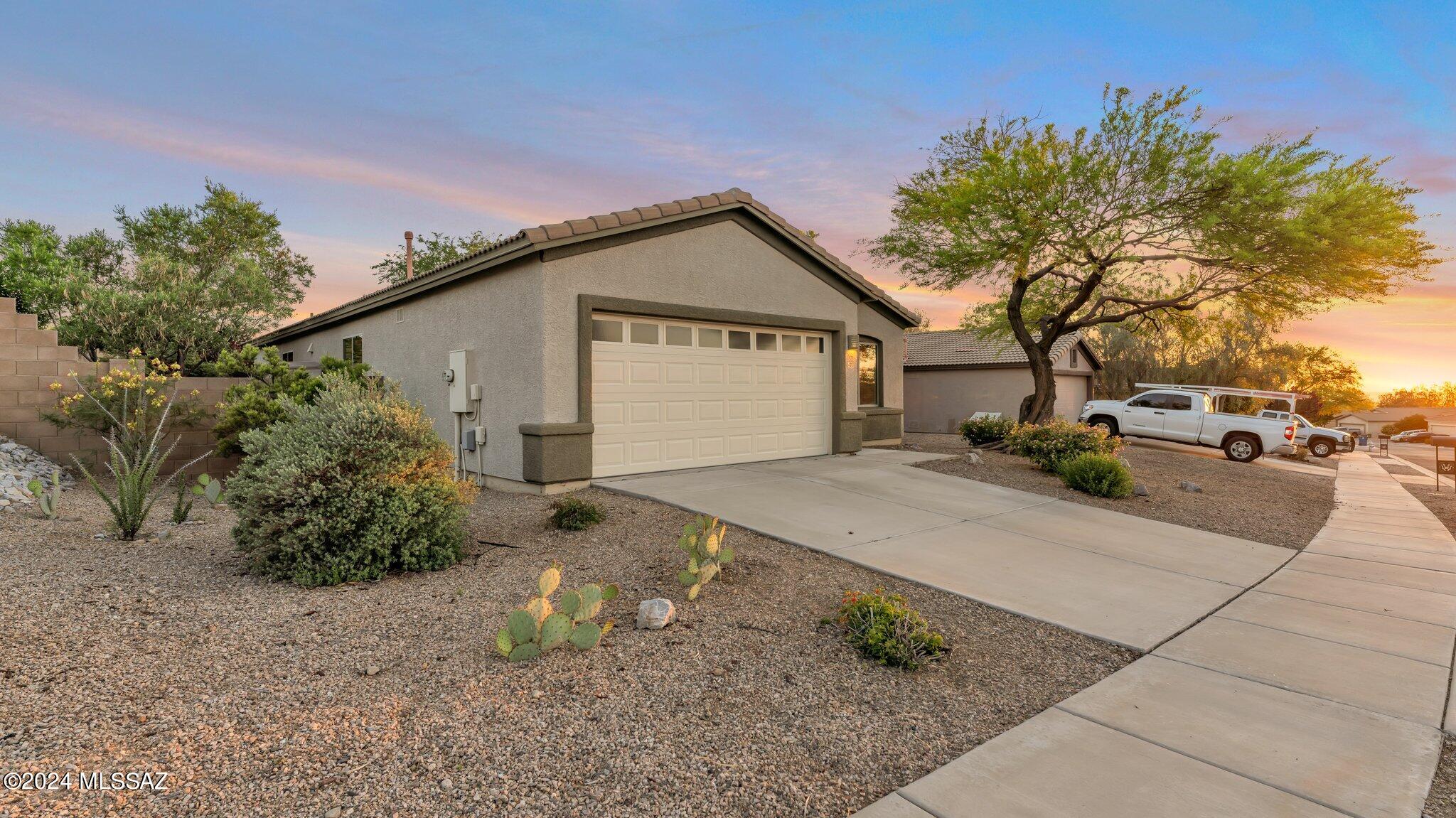Beautiful 3 bedroom home with a perfect, tranquil shaded backyard with mature trees. Everything has been taken care of for you: laminate flooring already installed in the bedrooms, the exterior and interior on this house has already been freshly repainted and all new stainless steel appliances in the kitchen. The main bedroom has French doors leading out onto the back patio where you can see the lovely Santa Rita Mountains and Mount Wrightson and the master bathroom has a shower and separate soaking tub. a fantastic home in the A+ Vail School District, ready for you to move in. Call today to schedule a showing!