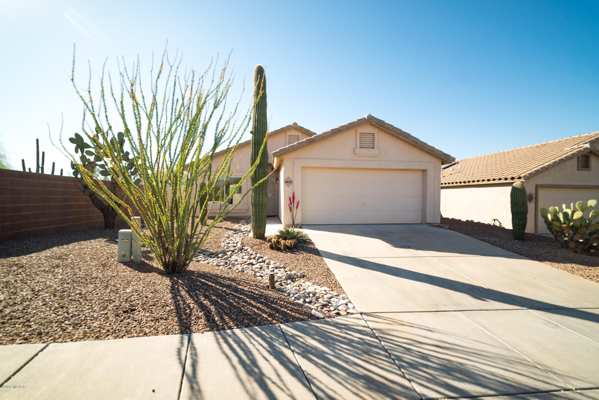 This ''Super Cute!'' 3 bedroom - 2 full bath - move in ready home, is now ready to show and can be yours today! Very well cared for, this home comes with all appliances, ceiling fans installed in all rooms, low ''E'' dual pane windows, full size two car garage and efficient gas stove, gas furnace & gas water heater! The low maintenance tile roof, care-free desert landscaping, east facing covered back patio & comfortable central AC make this home a great value! Expansive mountain views from the coveted south facing backyard and easy access location - plus the low HOA dues - explain why this home in The Villages at Redhawk is so desirable!  Located very close to Dove Mountain Park with a dog park, volleyball, tennis & BB courts This one will sell quickly...call for a showing TODAY!