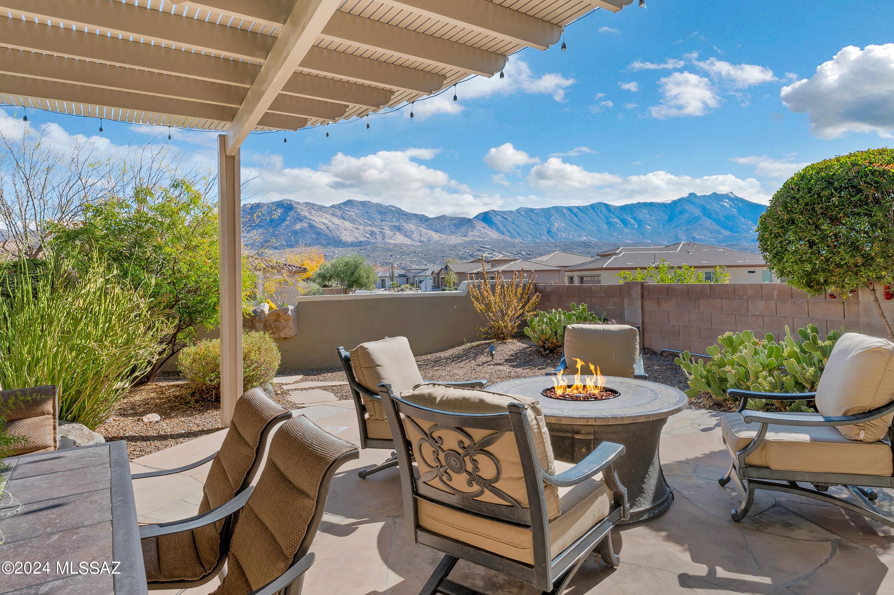 Fully renovated Preserve Santa Fe style Sabino model with mountain and desert view on 1/3 acre lot.  All new flooring, luxurious bathroom renos and kitchen updates make this home like new.  Gated front courtyard opens to sensational Santa Fe style, Great Room design with ceiling beams and new tv/fireplace focal wall.   Main house has split bedroom plan with 2 spacious suites each w/ private bath & outdoor access. Free standing Casita. Home designed for entertaining guests both inside & outside. Three private patios wrap around home with great flow to enjoy the outdoor space. Covered side patio has built in seating. Power sunscreens on rear patio. Mature, lush, beautiful landscaping surrounds the home. New salt water hot tub.
Furnishings available on separate bill of sale. 
Owner/Agent