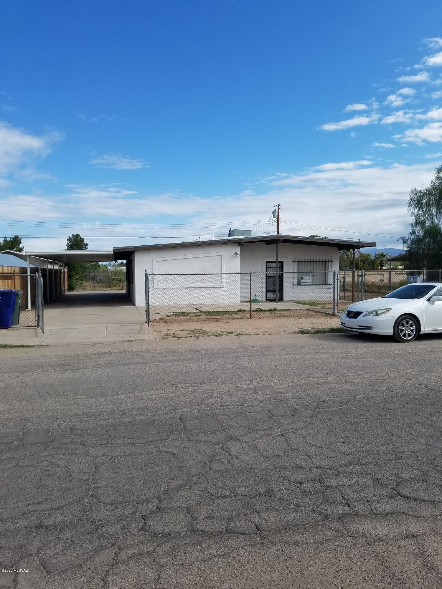 NEAT as A pin. Cozey well kept Recently Updated. LARGE lot with room for Tractor trailor ,RV and Boat Storage. Two gates to front Street,One Gate From Alley to front gate. 12x12 Metal storage shed. Chain link fened yard.NO HOA. Just installed Refigerator and stove ,new counter top.  Door and Window Have  Rod iron Securiy bars along with monitored coded security system for your Protection.