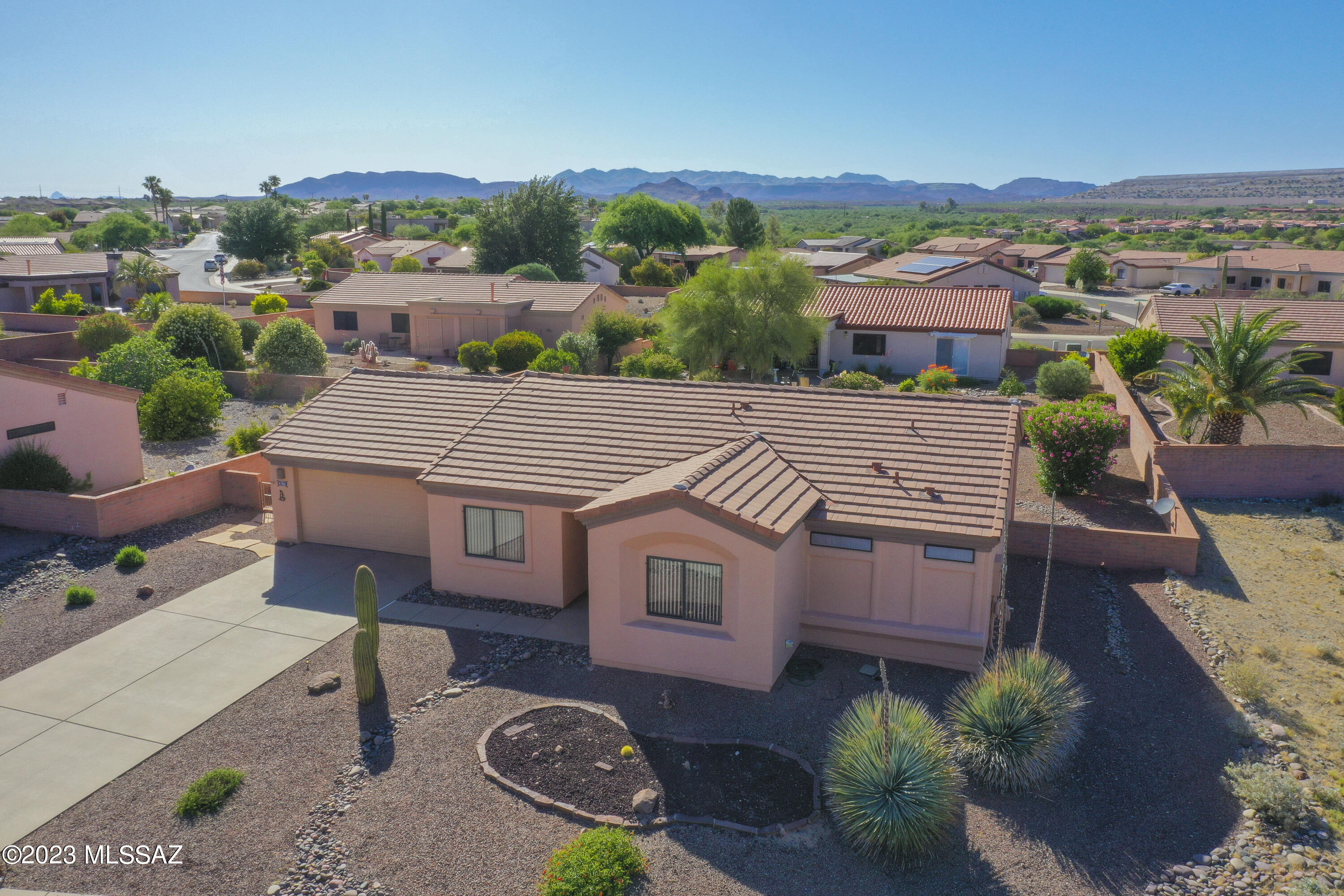 Very well maintained property, original owner, over sized garage with 2 closets and built in cabinets. Covered screened in patio in back. Newer garage door and opener. Large owner suite with large walk in closet. Split bedrooms. Good size lot, extra parking close by.