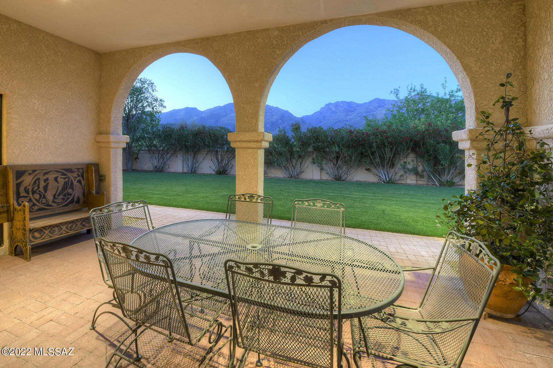 Distinctive architecture, embraced by fabulous Mountain Views! From secluded Cul de Sac, a Courtyard Garden with Fountain invites entry. Perfect venue for large parties, intimate groups, Family Fun! Gracious Liv Rm has Wall of Catalina Views. Relax in Expansive Yard's deep Brick Covered Patio w/ Beehive FP, taking in Mtns, lovely lawn/landscape, artful Water Feature. Bricked steps to lower yard, a cool lush Oasis Retreat w/ charming Pond. Tranquil hand-crafted Library w/ bold yet tasteful details, glide ladder, FP & Views. Romantic Master's 2 Balconies overlook City Lights & Mtns- Create the mood with music wafting from built-in speakers & the glow of 2-way FP shared by BR & luxurious Spa Tub. Chef's Kitchen! Formal DR opens to serene Courtyard. 20'x21' 3rd Garage w/ Incredible Workshop Kitchen: Slate Breakfast Bar, Granite Counters, Prep Sink, handsome, rich Cherry Cabinetry, extended prep area, Designer backsplash. New in 2022: West Wing A/C, LG Stainless Double Oven Gas Range, French Door Refrigerator, exterior paint. Laundry/Crafts Rm w/ abundant storage. Fam Rm quietly away off Kitchen. 3 Zones for Climate Control.
Rich Solid Slate Accents in home.  
3 A/C + Heat Zones for Climate Control.  Main Living area has A/C plus Evaporative Cooling. West Wing has New Heat pump. Family Room located quietly away off Kitchen with its own A/C plus Gas Heat. 3rd Car Garage / Workshop has Evaporative Cooling.
Workshop is prepped for under floor Dust Collection, 100 Amp Sub-panel, in-floor and ceiling power access. Full-size Safe conveys with home.
Gardener's Delight!  Big Grassy Yard, a Delightful Expanse of Cool Green for Parties, Family Fun! 4 programable zones for landscape irrigation. 11' x 6' Garden Storage with roll-up Door.
Recent Survey of lot. Roof Mounted Davis Weather Station.
Three Fireplaces: Propane used solely for Owner Suite Fireplace; Living Room / Library shared Fireplace is wood-burning; Patio Beehive Fireplace has Gas-start.
Main level Bedroom closet shelves fold up to reveal ladder rungs to Attic Storage.  Cimarron 24-Hour Security Patrol. HOA covers trash collection.