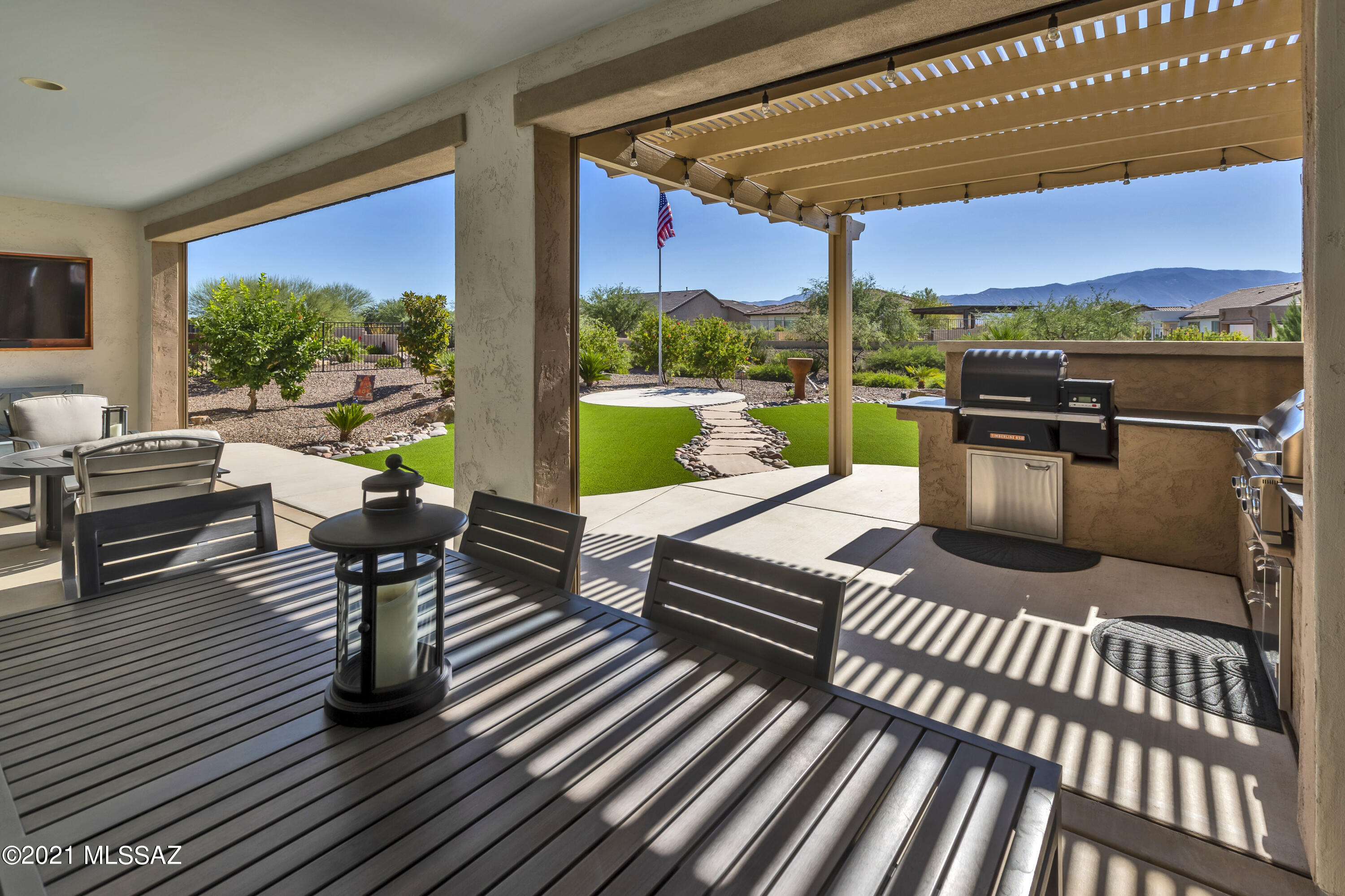 This beautiful and tastefully appointed Tesoro model offers a wonderful view of Mount Lemmon! The backyard is well planned with a built-in grill, pergola, raised garden bed, fruit trees and lovely landscaping. The interior has many upgrades, including stainless steel GE Monogram kitchen appliances, tile flooring, quartz counter tops, Barn doors in Master Bath, expanded Master bedroom, walk-in closet and storage galore! Expanded garage with epoxy floor and golf cart bay. Don't wait to build new when you can save money, move in quickly and start enjoying all that SaddleBrooke Ranch has to offer!