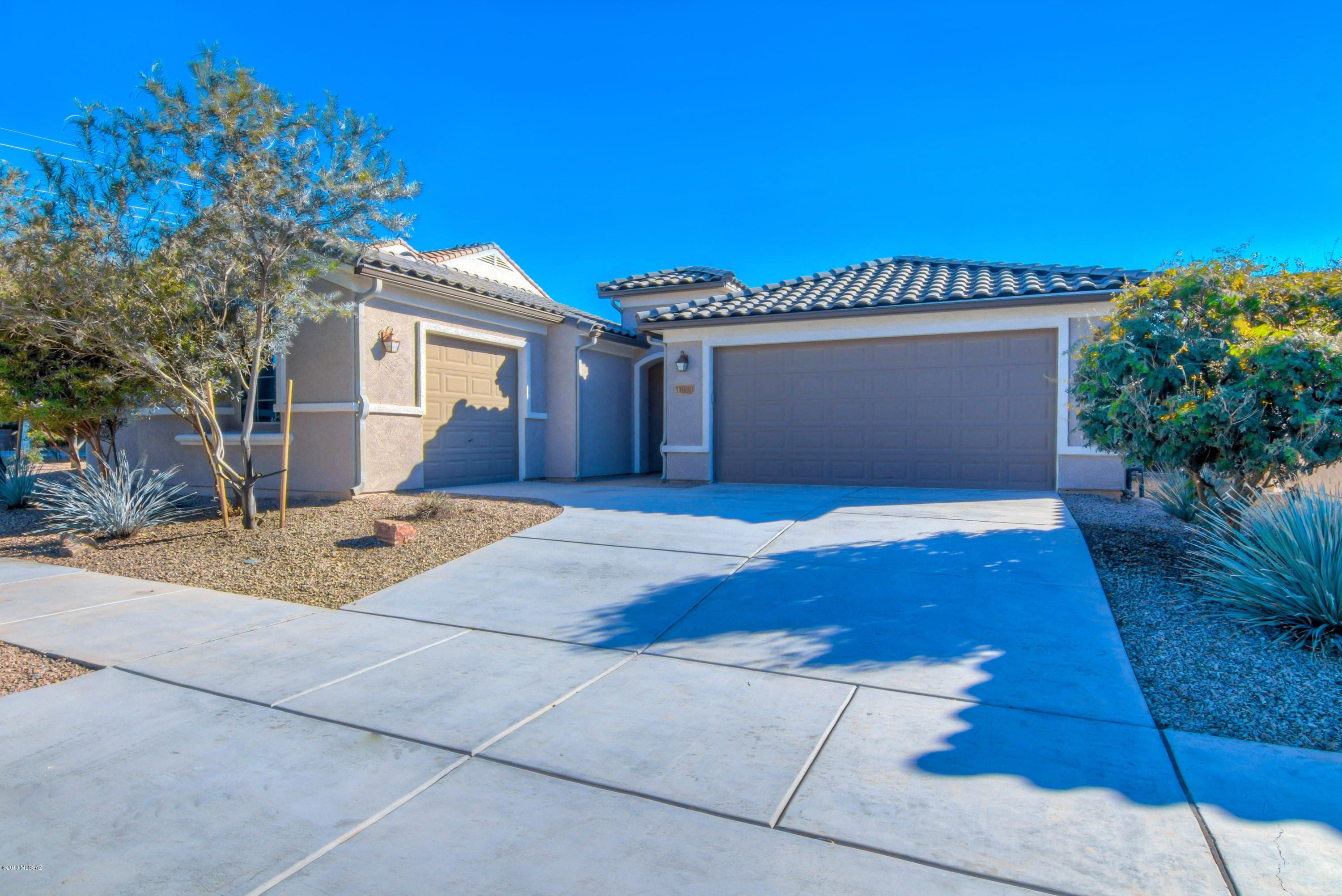 Beautiful Home with Custom Upgrades!  Home features Great Room with built-in Entertainment Center, surround sound pre-wire with ceiling speaker covers, retractable double glass slider to back patio for indoor / outdoor living, soaring ceilings throughout home, 20'' ceramic tile in main living areas & bathrooms, new neutral carpet in bedrooms, owned solar system with net metering & much more. Open Kitchen offers granite slab counters, rich wood cabinets, center island with bar seating, stainless appliances & large walk-in pantry. Master with walk-in closet, dual sink vanity & custom tile shower. Covered back patio opens to spacious backyard. Walking distance to Vail elementary and middle schools in the neighborhood. Owner/Agent
