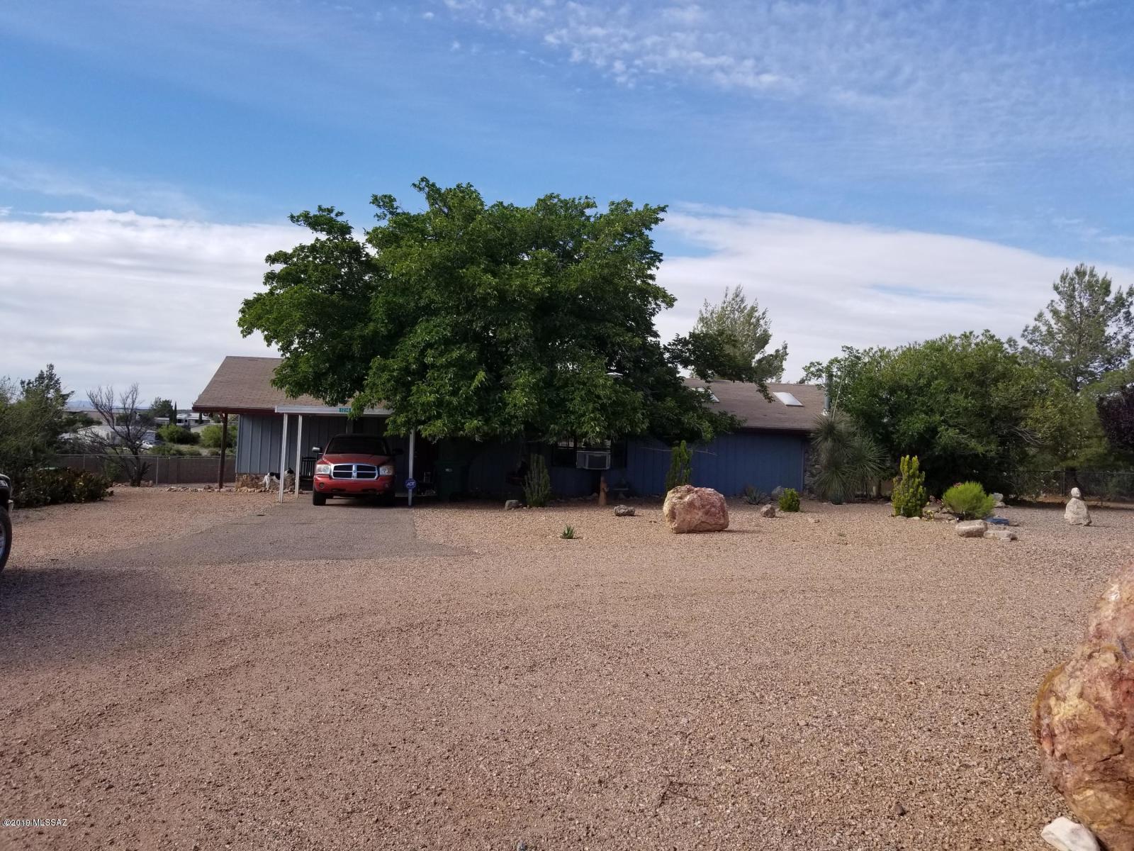 Unique and private.  It is located on a large lot with plenty of desert landscape and two storage sheds. There is a nice additional building that was previously used for massage therapy.