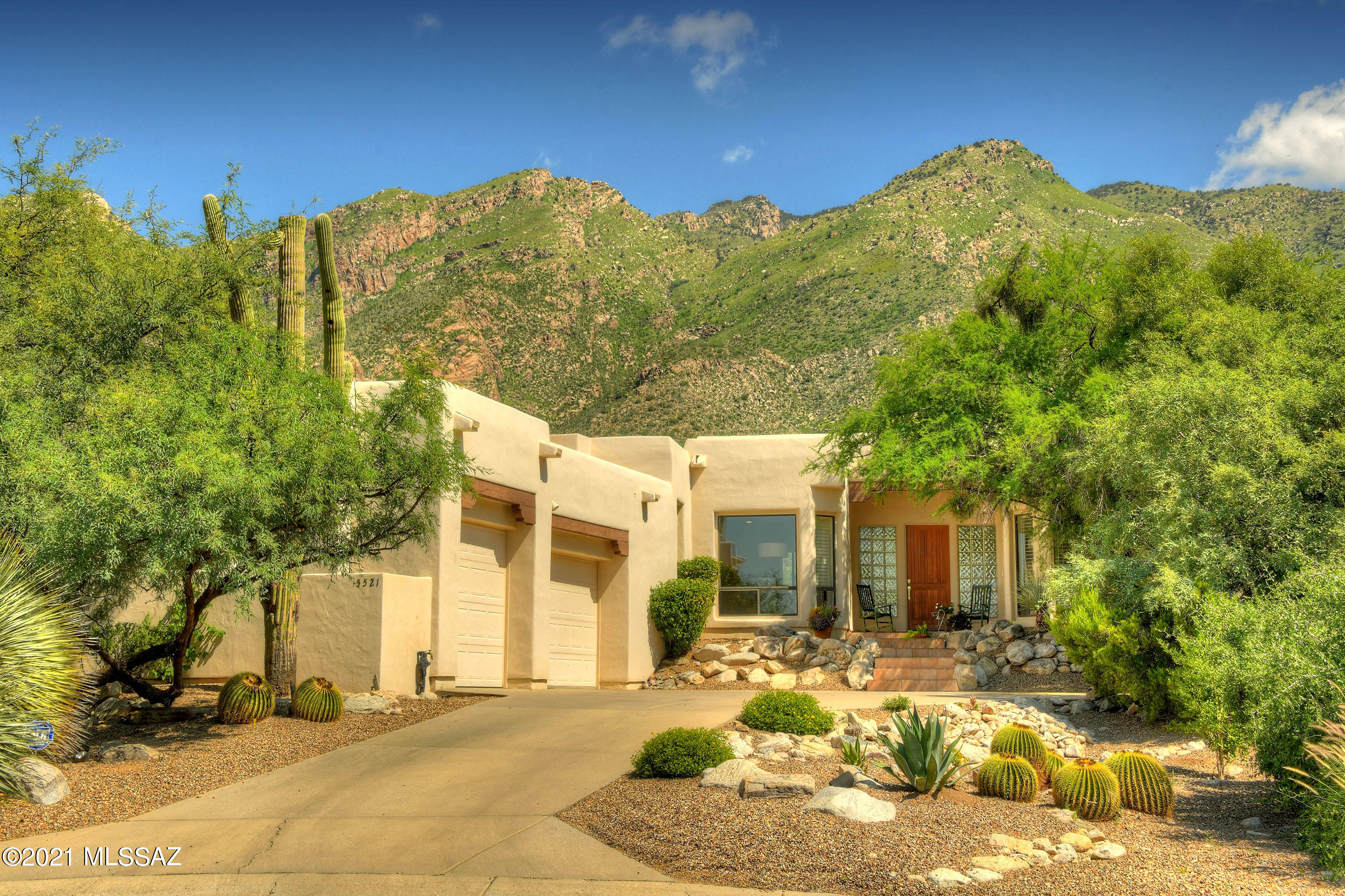 You will be impressed by the meticulous enclave of Silverton at the base of the Catalina Mountains. Situated at the end of a Cul-De-Sac with N/S exposure, you have a center seat while looking through the floor to ceiling picturesque windows at the panoramic mountain views. No need to block the views either as the lush Sonoran Landscape is dense & lush providing you w/ all the privacy one requires. This light & bright, 3 bedroom plus a den, split bedroom floorplan provides for a carefree, seamless lifestyle for indoor/outdoor living. An oversized 3 car garage w/ plenty of storage, bamboo flooring & a recently remodeled kitchen are just some of the amenities you will love. No need to worry about the mechanics as both heating & cooling systems have been replaced within the year & all plumbing in the home and to the street were replaced back in 2013.