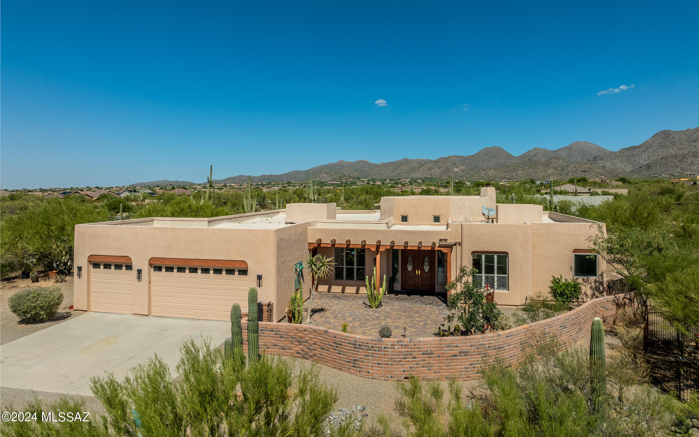 Superb location - custom built single story home on almost 4 acres surrounded by natural desert plants & gardens. Spectacular mountain, city light, sunset & sunrise views. Panoramic beauty everywhere. This private & serene location has No HOA, city water, propane gas. There are No steps & No carpet. Original home has been expanded -pushing out kitchen to a grand chef's masterpiece + added an additional bonus/craft/art room. Remodeled master bathroom  w/one-of-a-kind custom metal art barn door. Very spacious gated front artistic courtyard. Property will convey w/many installed outside custom local art pieces.  HVAC units replaced in 2018 & 2020. Electric hot H20 heater replaced Feb 2018. Private, serene living surrounded by nature. Recently added fencing to backyard. Interior just painted.