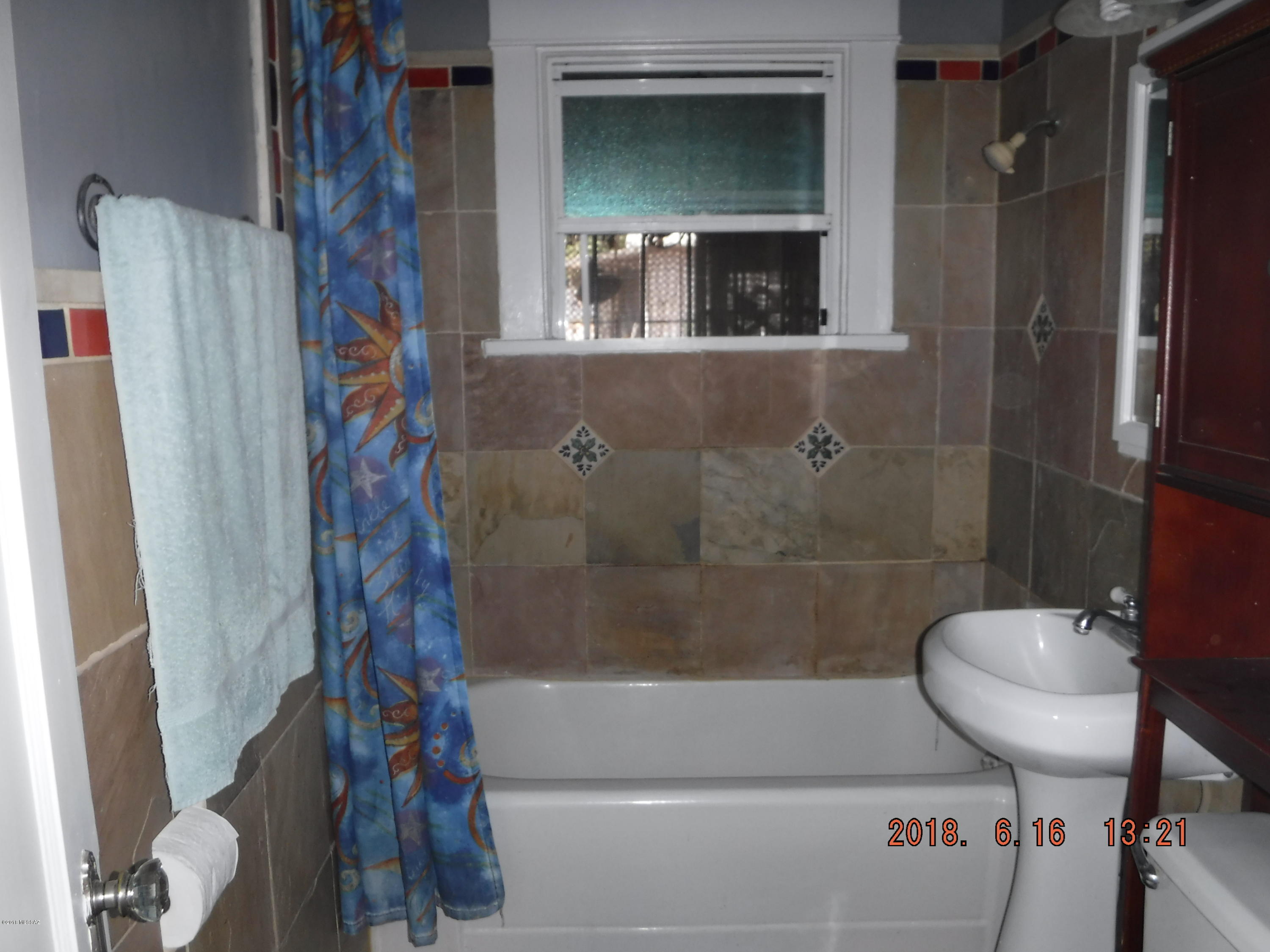Sweet little house with fenced front yard. A/C, ceiling fans thru out Dual paned windows. Nice breakfast bar looking into living room. Covered front porch. Wrought iron on all windows and doors  Dogs may be negotiable. Smoking outside pls.