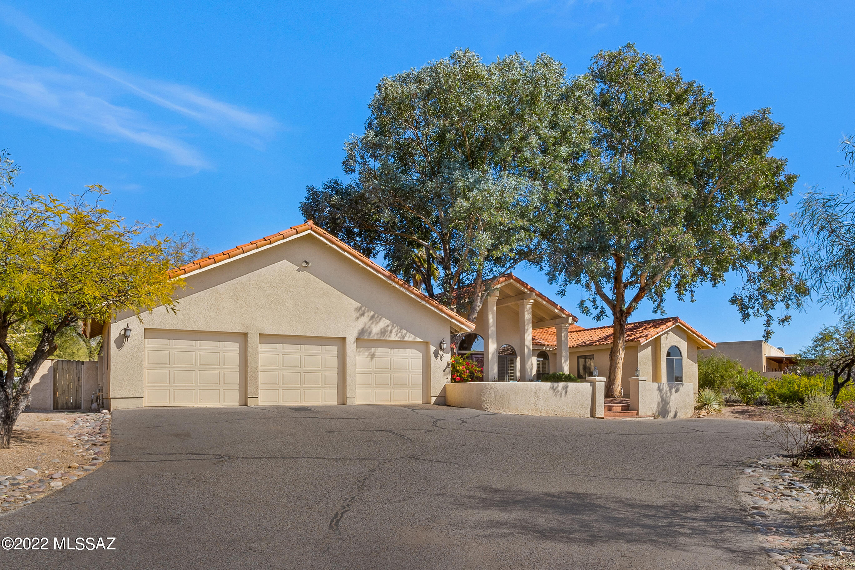 Beautiful Foothills home located in highly desirable Shadow Hills on a prime lot with mountain views from inside & out. Soaring 20'' ceilings welcome you into the home with beautiful hardwood floors, abundant natural lighting & an open floorplan. Mountain views can be enjoyed in the spacious master suite while lying in bed or relaxing jacuzzi tub. The ensuite bath also features a separate shower, dual vanities, & two closets. Prepare dinner in the chef's kitchen with black slab granite counters or on the grill in the outdoor kitchen. The lush backyard is the perfect place to enjoy time outside with friends & family.  In addition to 3 large bedrooms the home has a spacious office, 2.5 baths, laundry room, & 3 car garage.  District 16 schools & minutes from La Encantada