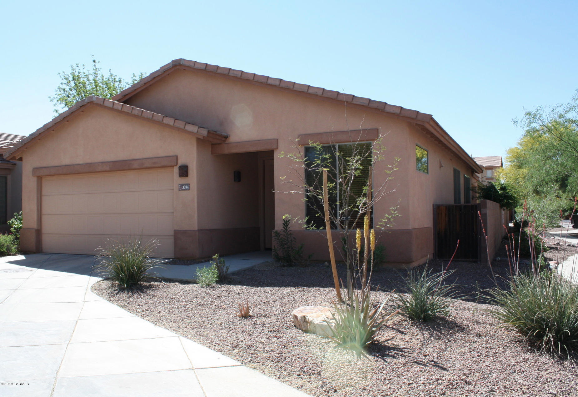 Location, location, location! This well maintained home is located near shopping, dining and much more.  2BD/2BA plus a den. Gated community.  Two car garage and corner lot. Beautiful tile flooring throughout (no carpet!). Community pool & spa and gate access to Rillito River Walk & Bashas grocery store.  Won't last long!
