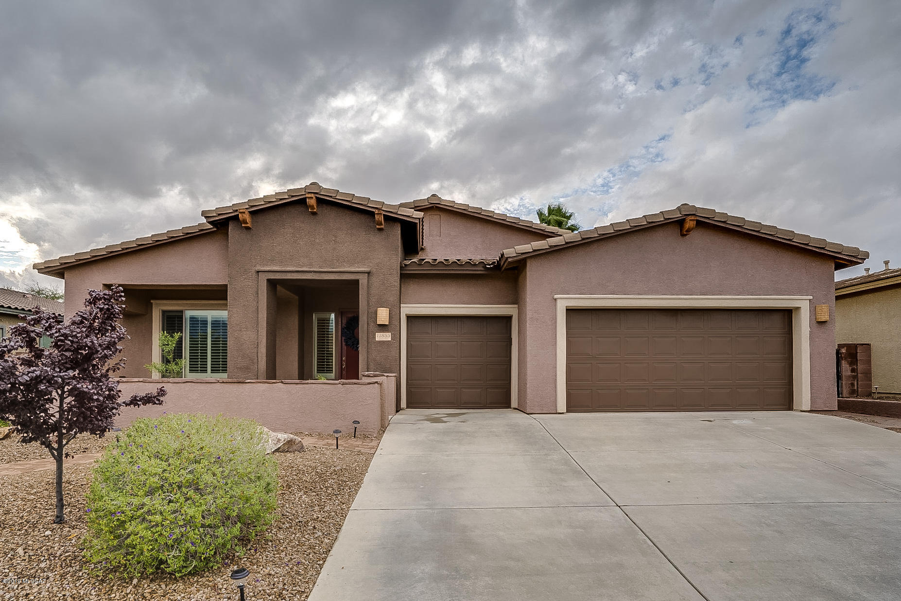 Hard to find any challenges with this floor plan!!  Single story 5 bedroom 3 full baths w/den. Open and spacious kitchen including stainless steel appliances, induction cook top, double oven, large walk in pantry.  Great room featuring beautiful stone fireplace.  Bright and open Master bedroom with en-suite bathroom to include large custom walk in shower, dual executive height vanity, large walk in closet complete with built-ins. Split floor plan, plantation shutters, new carpet.   Extended length garage large enough for work area or just to accommodate that hard to fit large SUV or Truck.  Exterior space of this home is just as remarkable as interior.  Pool and spa, covered and uncovered patio areas, basketball area, Beautiful courtyard perfect for relaxing and enjoying views of Catalinas