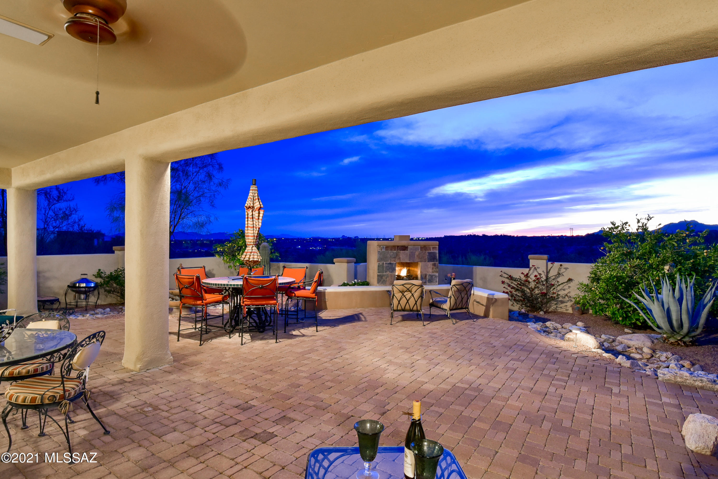Views (east & west), serenity and relaxation! Enjoy coffee on your spacious elevated front patio as the sun rises or evening drinks as the sun casts a pink hue over the majestic Catalina Mtns. Equally large rear patio with gas Fpl & built-in BBQ offers views of Tortolita Mtns and famed AZ sunsets painting the sky orange. Lovely single-level home in gated Estates of High Mesa in Oro Valley's Rancho Vistoso master planned community! Inviting open layout with Travertine floors (wood floors in den/media rm, carpet in bdrms). Gorgeous custom kitchen with Sub-Zero, Dacor & Bosch appls! Split plan for privacy with formal dining and media/den in addition to 4BDs/3BAs (3BDs if room near master is used as Office). Oversized 2.5 car garage (space to add 1-car gar). Room for pool front or rear patio!