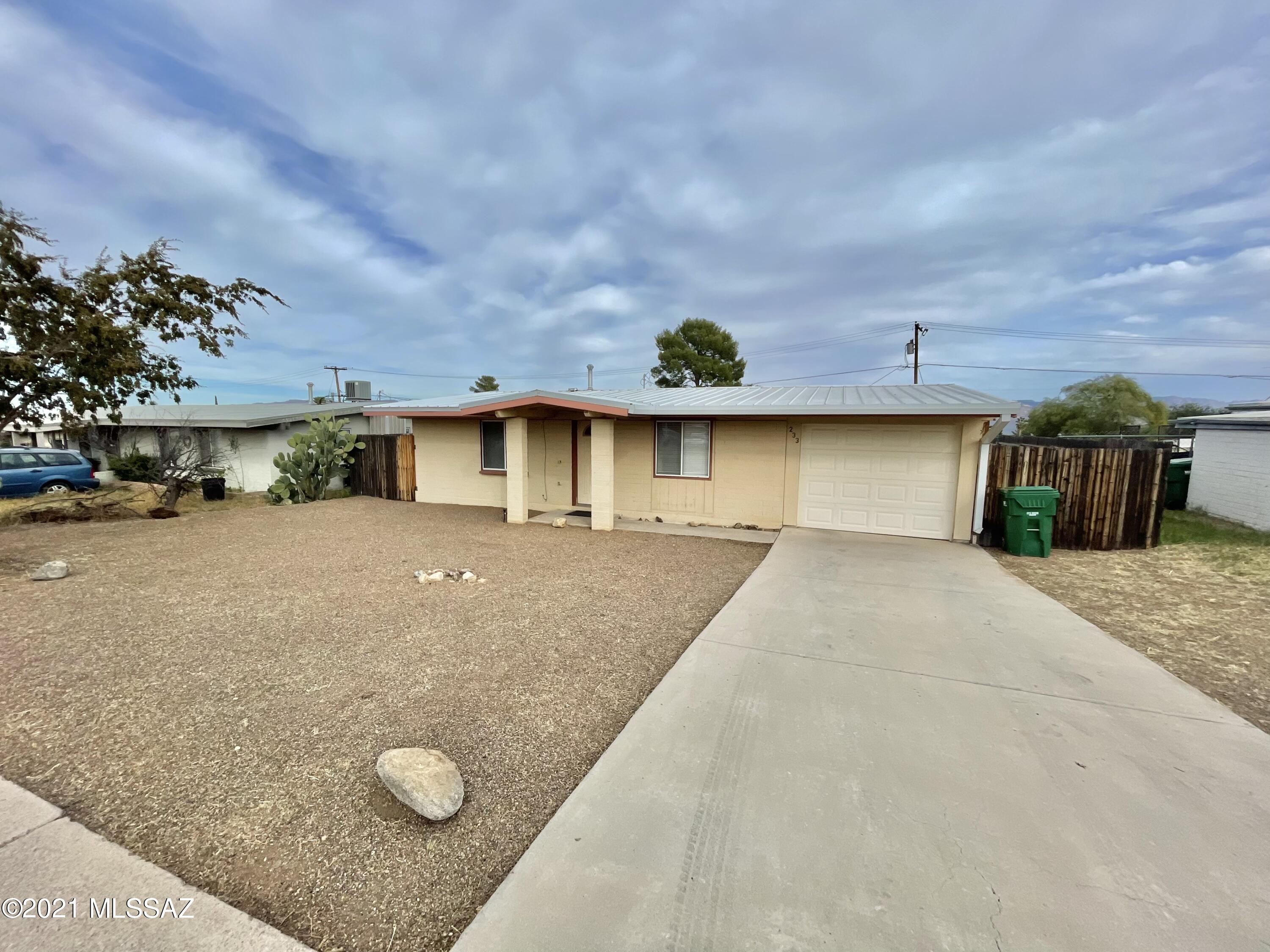Photos are old and will be retaken soon. Remodeled 2 bed / 1 bath home with many upgrades, including new paint inside, updated kitchen with custom cabinets, dishwasher, brand new refrigerator & garbage disposal. Tile florring in living areas and bathroom. Backyard features incredible mountain views, privacy fencing, and a separate storage shed. Covered carport for parking, with remote-controlled garage door.

Please text 520-490-5232 with property address and your email for application and to schedule a showing.