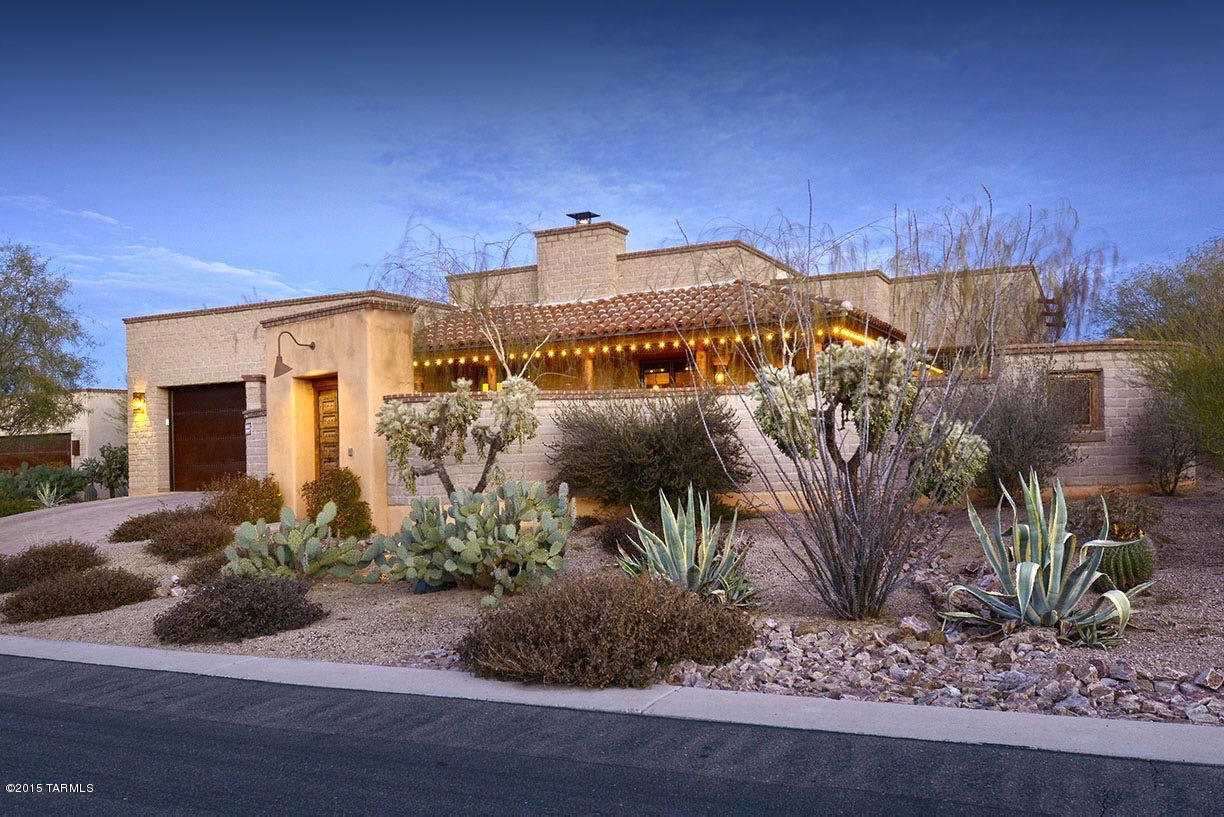CLASSIC ARCHITECTURE MIXES WITH AN ELEGANTLY CASUAL SPACE CUSTOM TAILORED FOR THOSE SEEKING THE DESERT LIFESTYLE. ENTER THROUGH A 2-FOOT THICK, ANTIQUE GATED BUTTRESS, ONTO THE PRIVATE COURTYARD WITH FIREPLACE & CATALINA MTN VIEWS. INTERIORS INSPIRED FROM REGIONAL DESIGN & COMPLEMENTRAY ELEMENTS, SUCH AS KNOTTY ALDER CABINETRY & 1 3/4'' DOORS, POLISHED CONCRETE FLRS & COUNTERS, GOURMET KITCHEN WITH FULL VIKING APPLS PACKAGE, CUSTOM STEEL CASEMENT EXTERIOR DOORS, ROUGH-SAW WOOD & VIGA BEAMED CEILINGS, SET AGAINST A NEUTRAL COLOR PALETTE, ADDING LAYERS OF TEXTURE THAT REFLECT THE NATURAL SURROUNDINGS. THE REAR COVERED VERANDA, WITH BUILT IN BBQ, AS WELL AS WOOD BURNING GRILL, OVERLOOK THE POOL & COVERED OUTDOOR DINING AREA, EMPHASIZING ENTERTAINMENT AS A KEY ELEMENT OF THE ARIZONA LIFESTYLE.